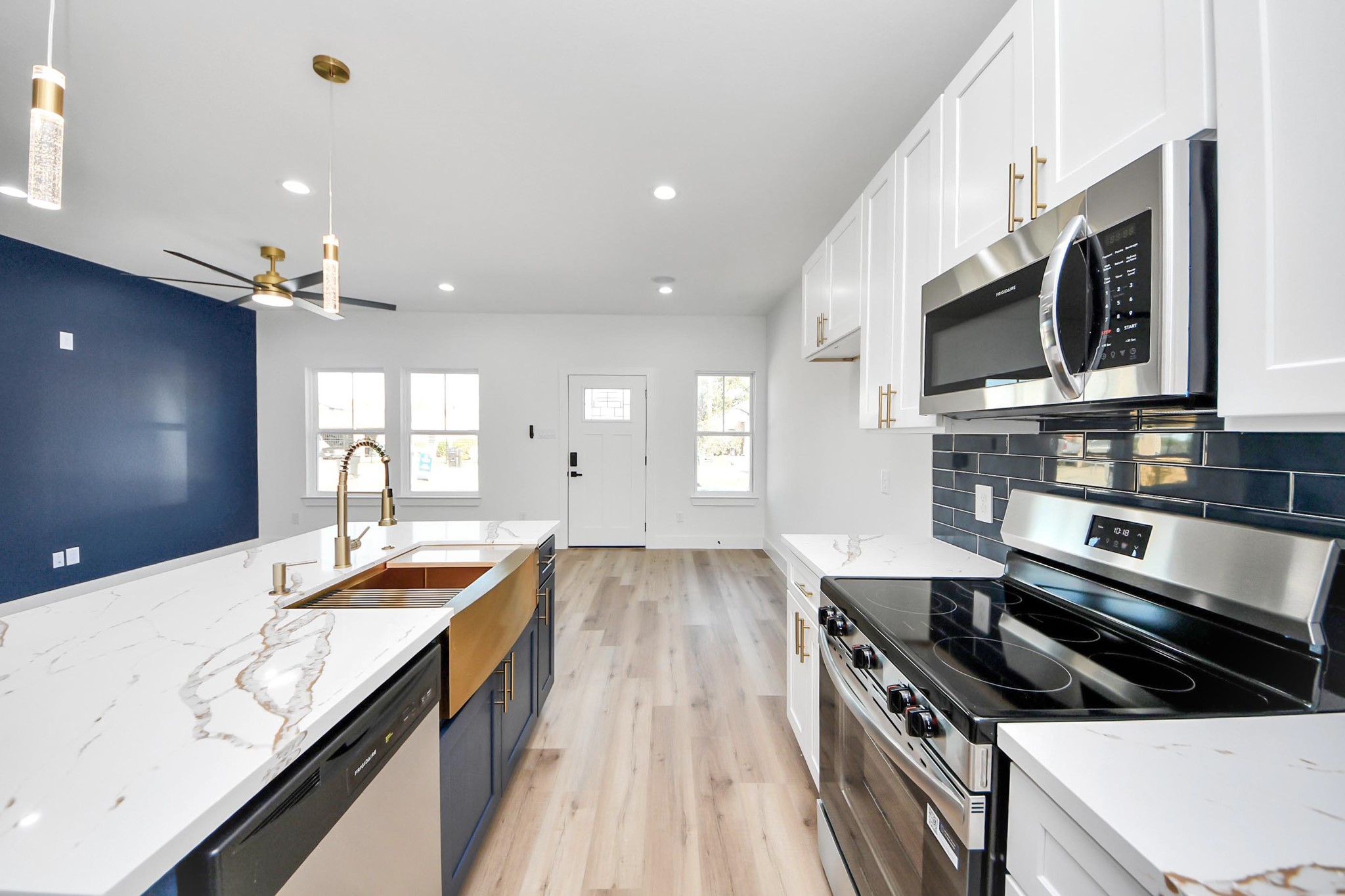4606 Mallow Street Houston, TX 77051 - Photo 4 of 31 a kitchen with stainless steel appliances granite countertop a stove and a sink