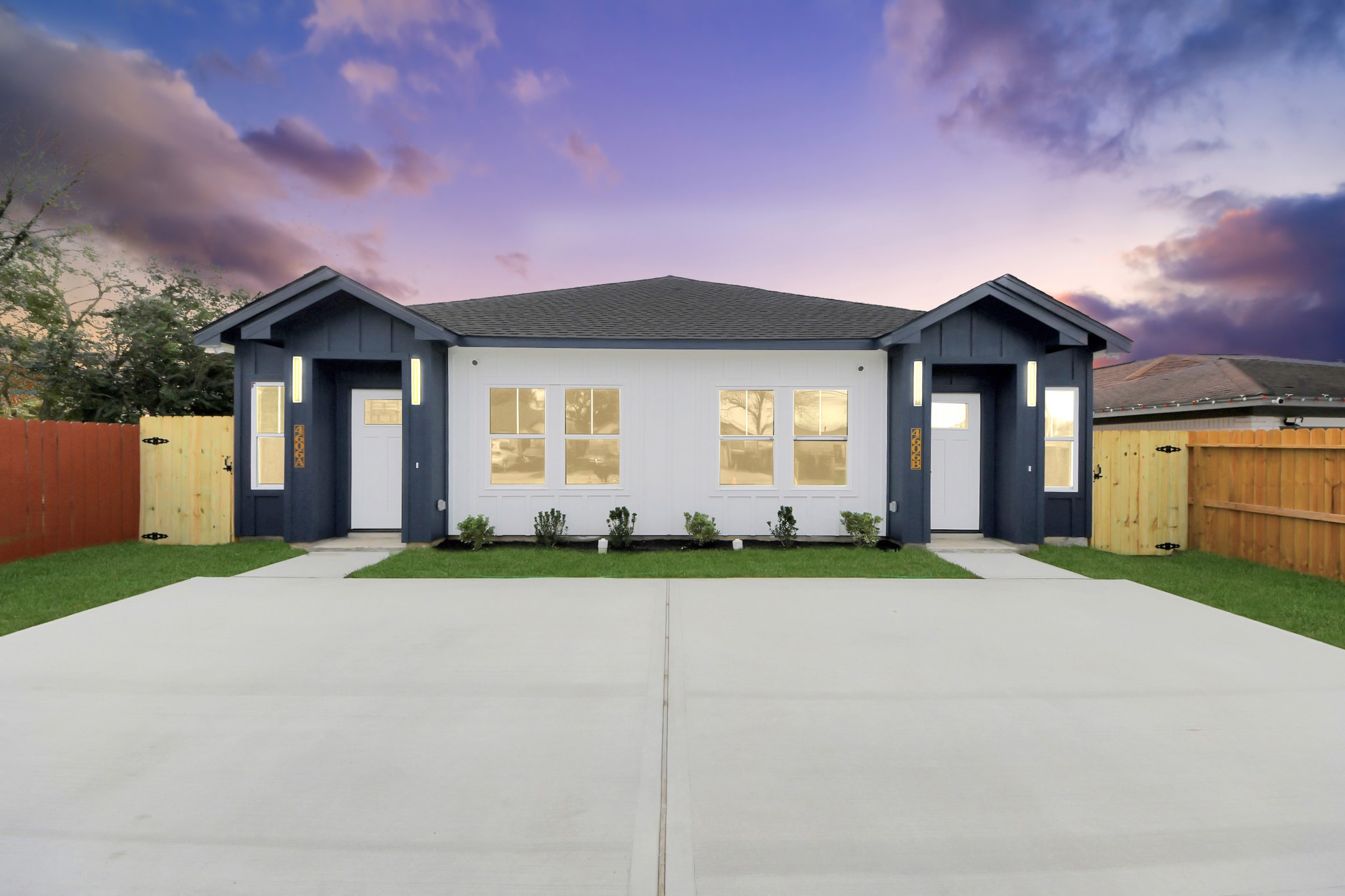 4606 Mallow Street Houston, TX 77051 - Photo 7 of 31 a front view of a house with a yard and garage