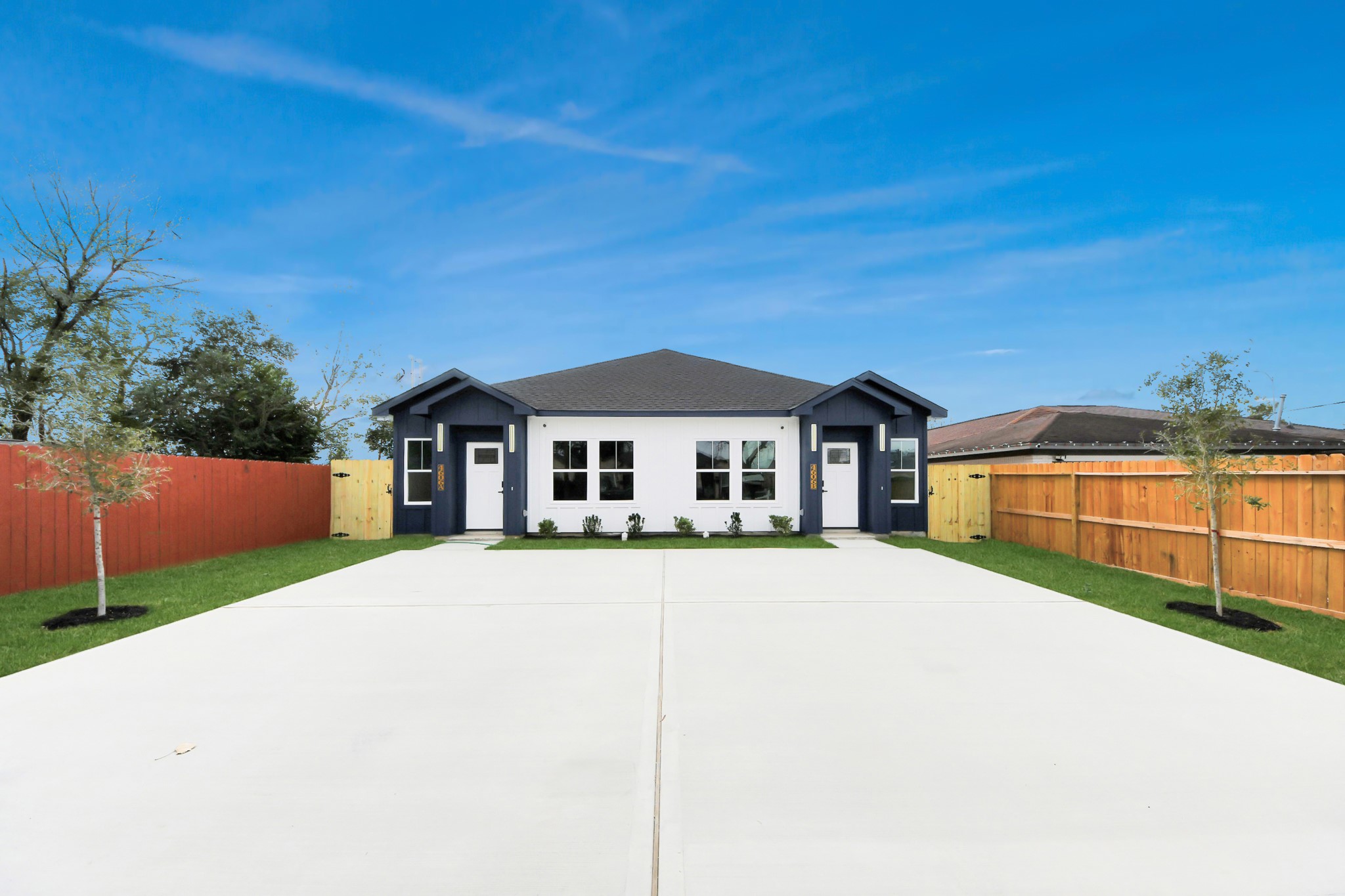 4606 Mallow Street Houston, TX 77051 - Photo 8 of 31 a front view of a house with a yard and garage