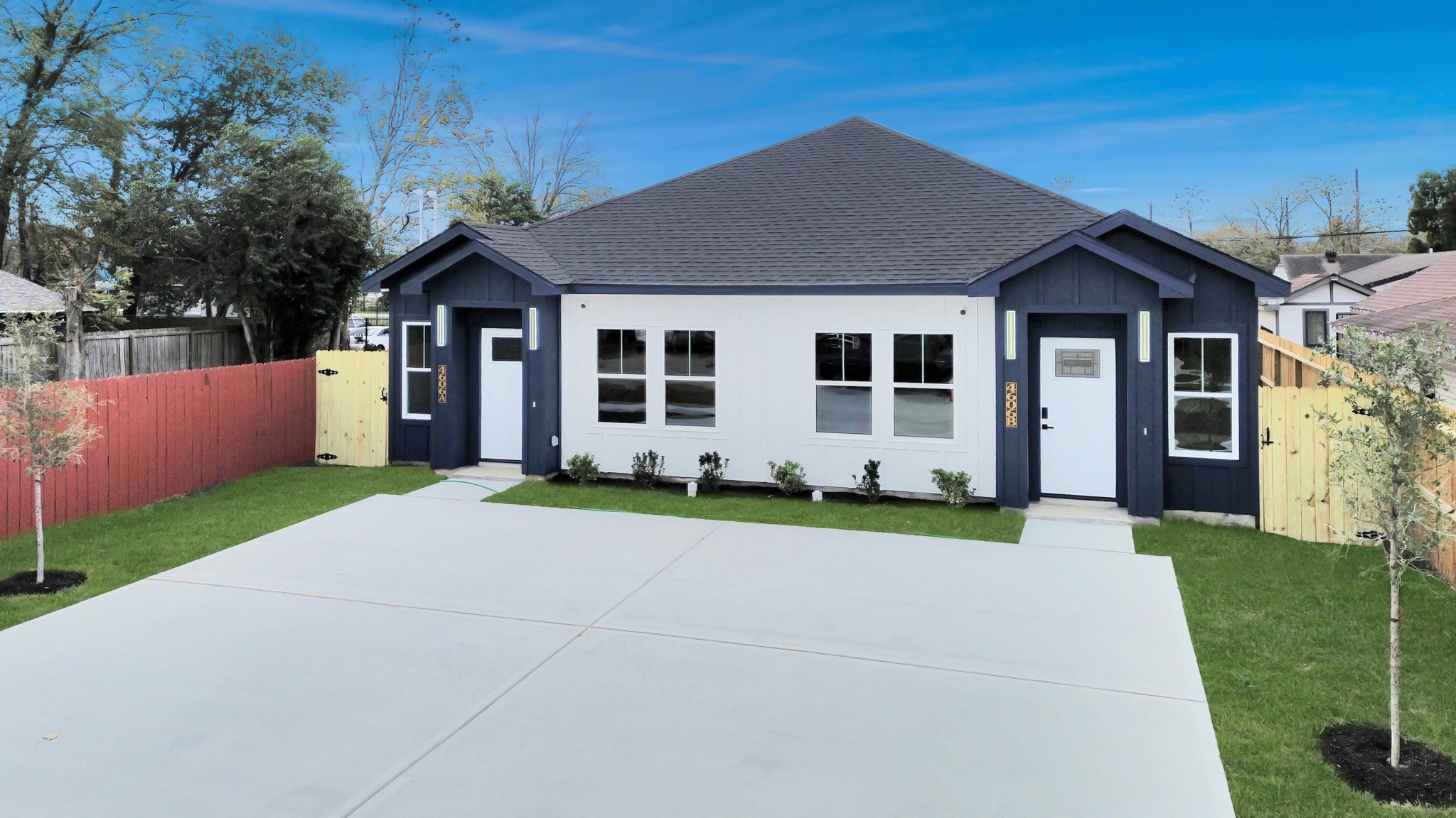 4606 Mallow Street Houston, TX 77051 - Photo 9 of 31 a front view of a house with a yard and trees