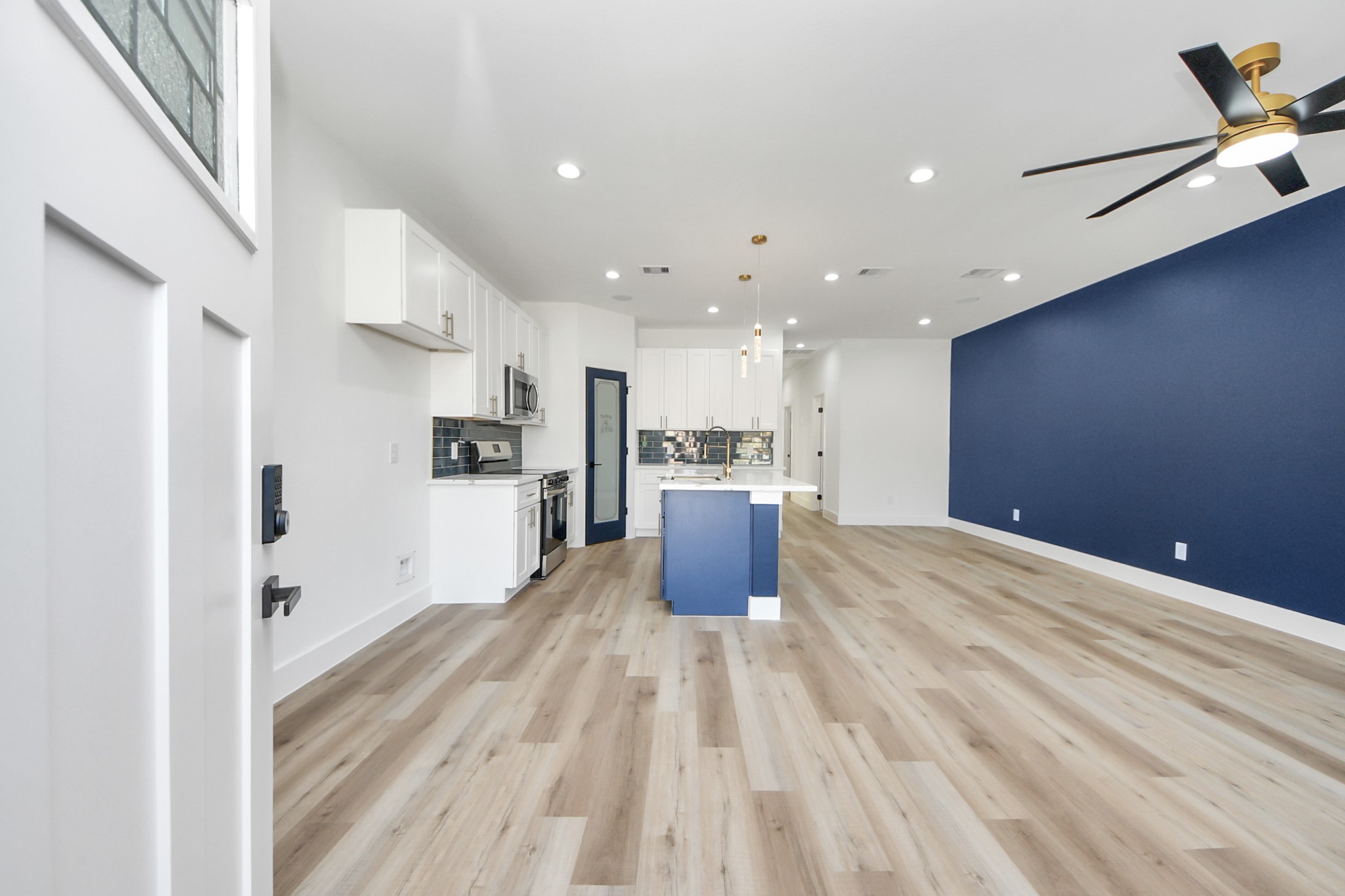 4606 Mallow Street Houston, TX 77051 - Photo 10 of 31 a kitchen with stainless steel appliances kitchen island granite countertop a refrigerator and a sink
