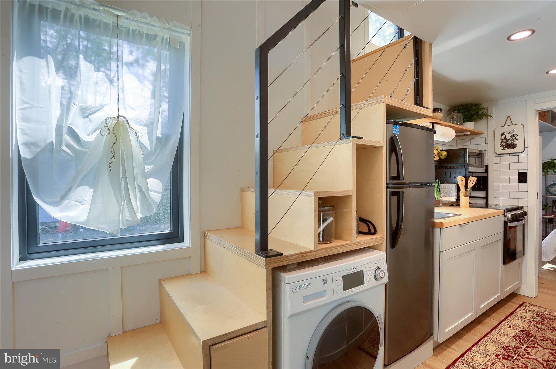 Convenient washer/dryer combo utilizing the space.