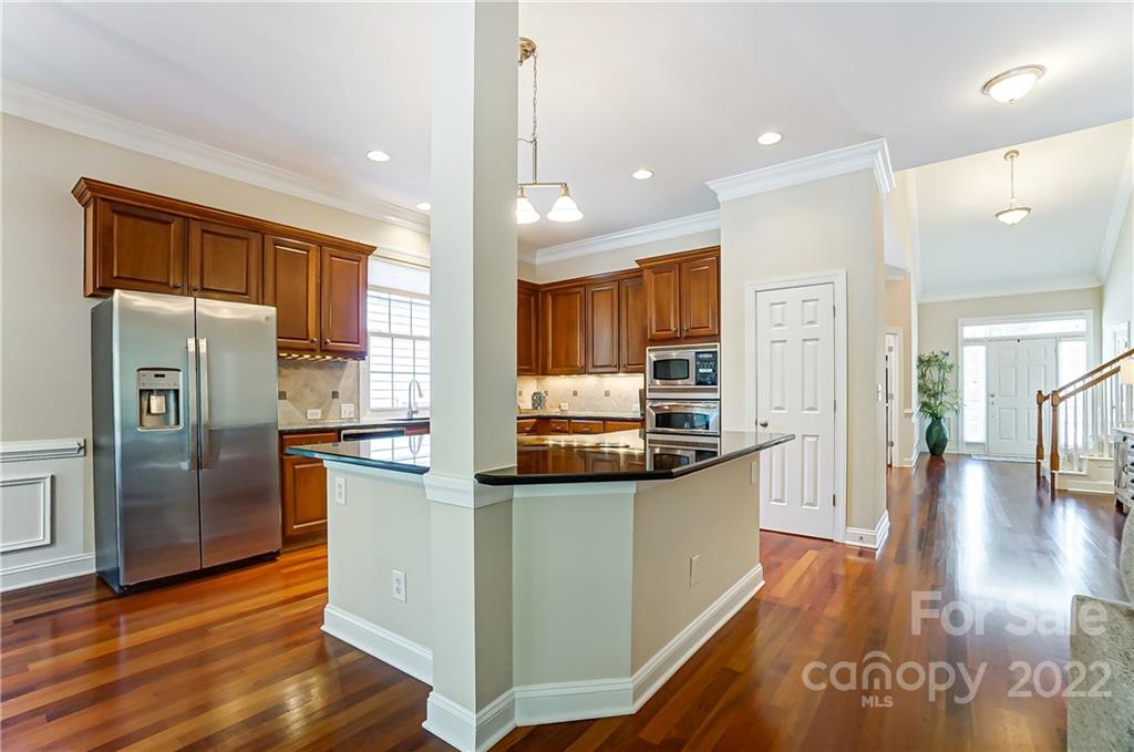146 Mills Lane Fort Mill, SC 29708 - Photo 13 of 48 a kitchen with stainless steel appliances a refrigerator and a stove top oven