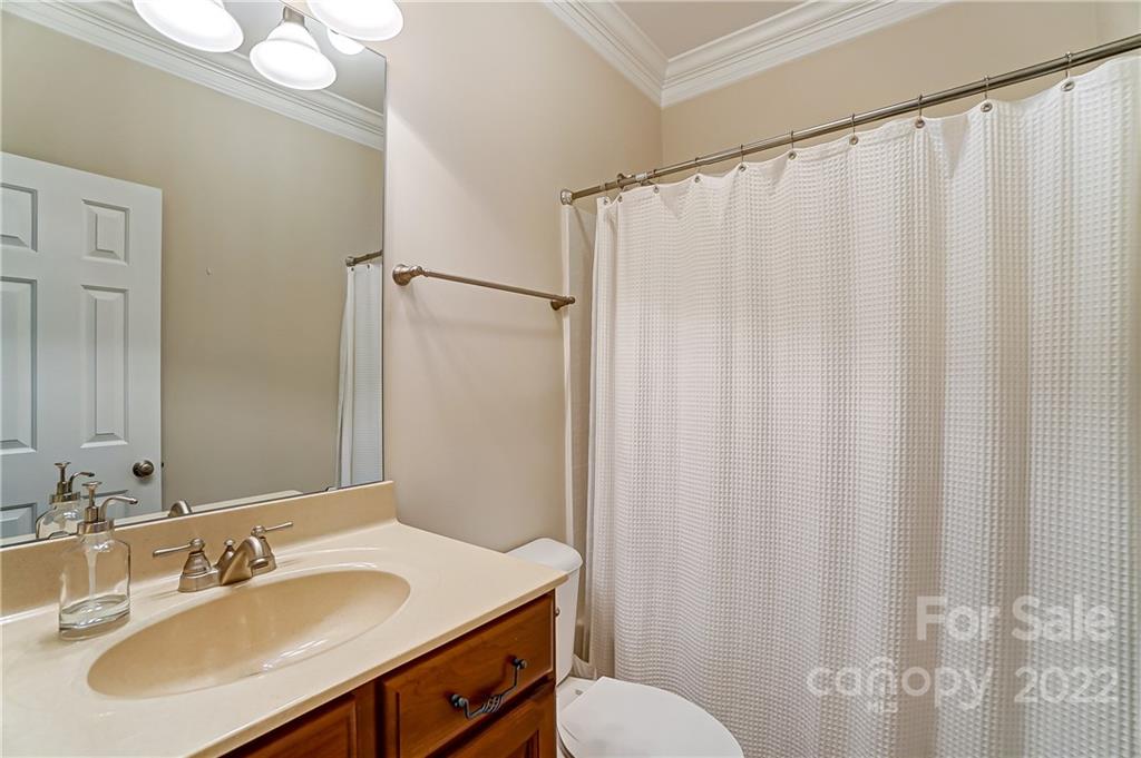 146 Mills Lane Fort Mill, SC 29708 - Photo 36 of 48 a bathroom with a sink and a mirror
