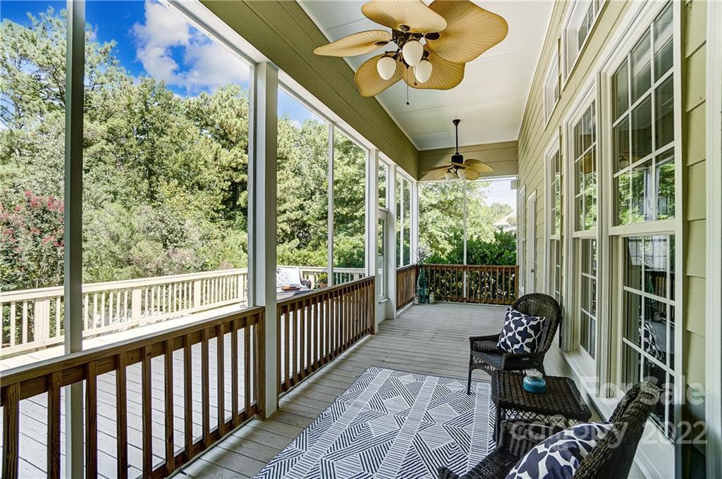 146 Mills Lane Fort Mill, SC 29708 - Photo 42 of 48 a view of a porch with chairs and backyard
