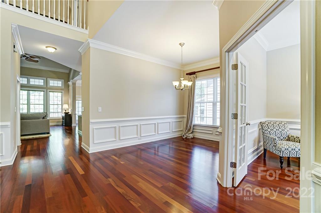 146 Mills Lane Fort Mill, SC 29708 - Photo 8 of 48 a view of a hallway with wooden floor and furniture