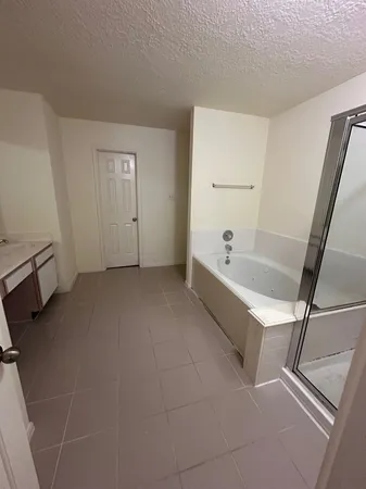 a bathroom with a bathtub and a sink