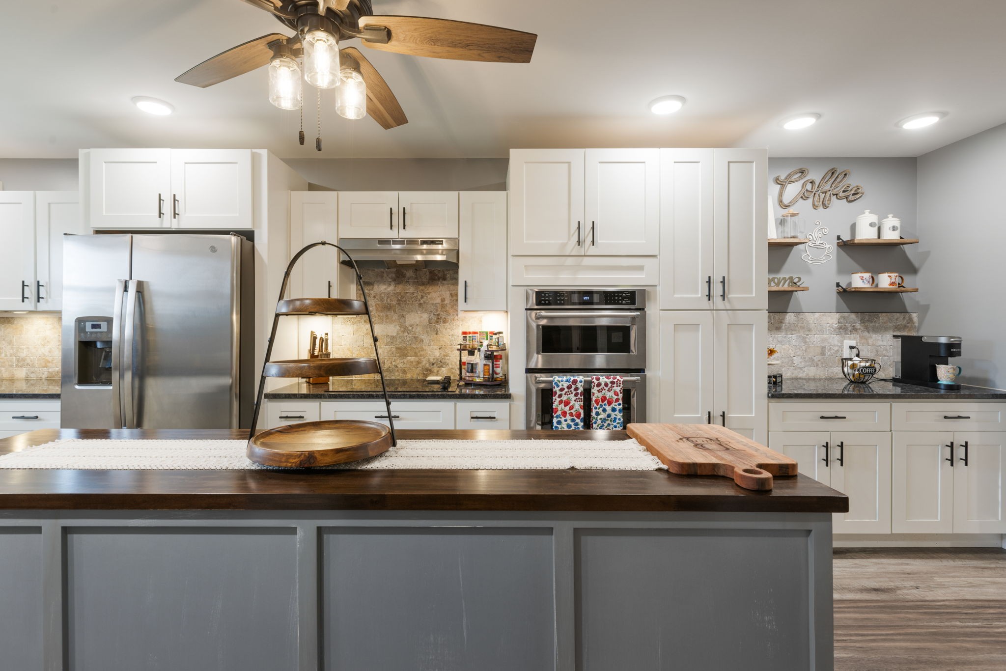 3030 Cherry Corner Road Cornersville, TN 37047 - Photo 11 of 66 a kitchen with stainless steel appliances a sink a refrigerator a stove a microwave and cabinets