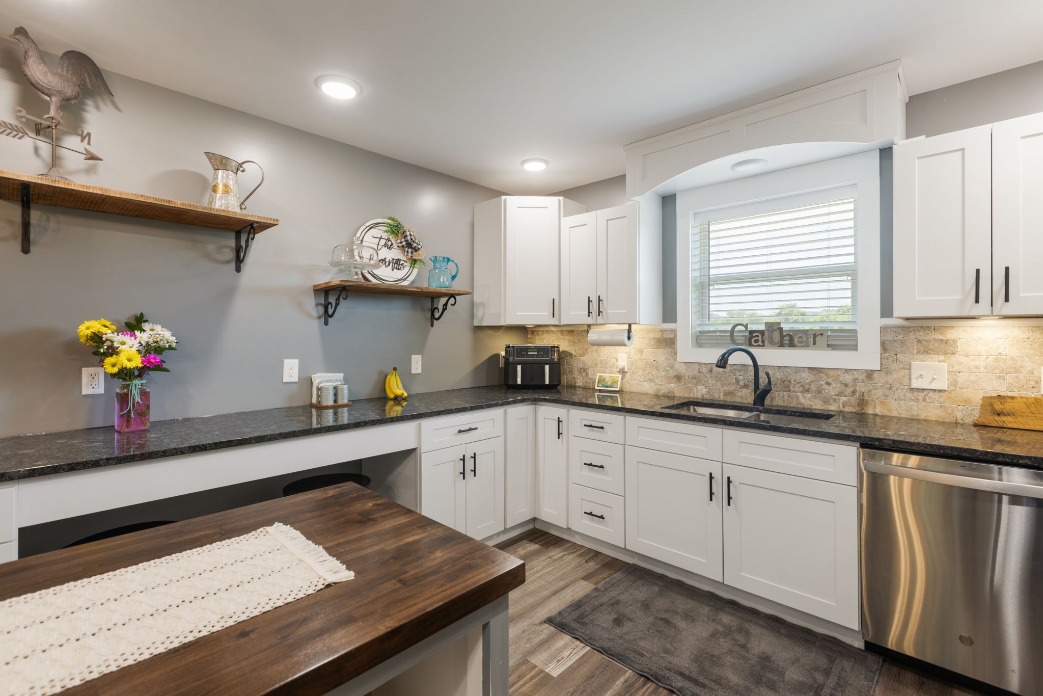 3030 Cherry Corner Road Cornersville, TN 37047 - Photo 13 of 66 a kitchen with granite countertop a sink white cabinets and a stove