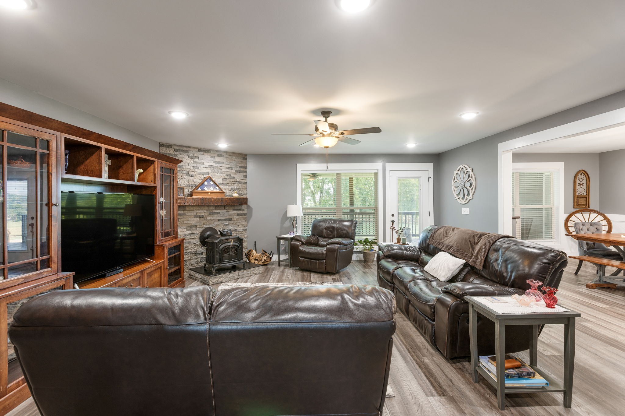3030 Cherry Corner Road Cornersville, TN 37047 - Photo 19 of 66 a living room with furniture a flat screen tv and a large window