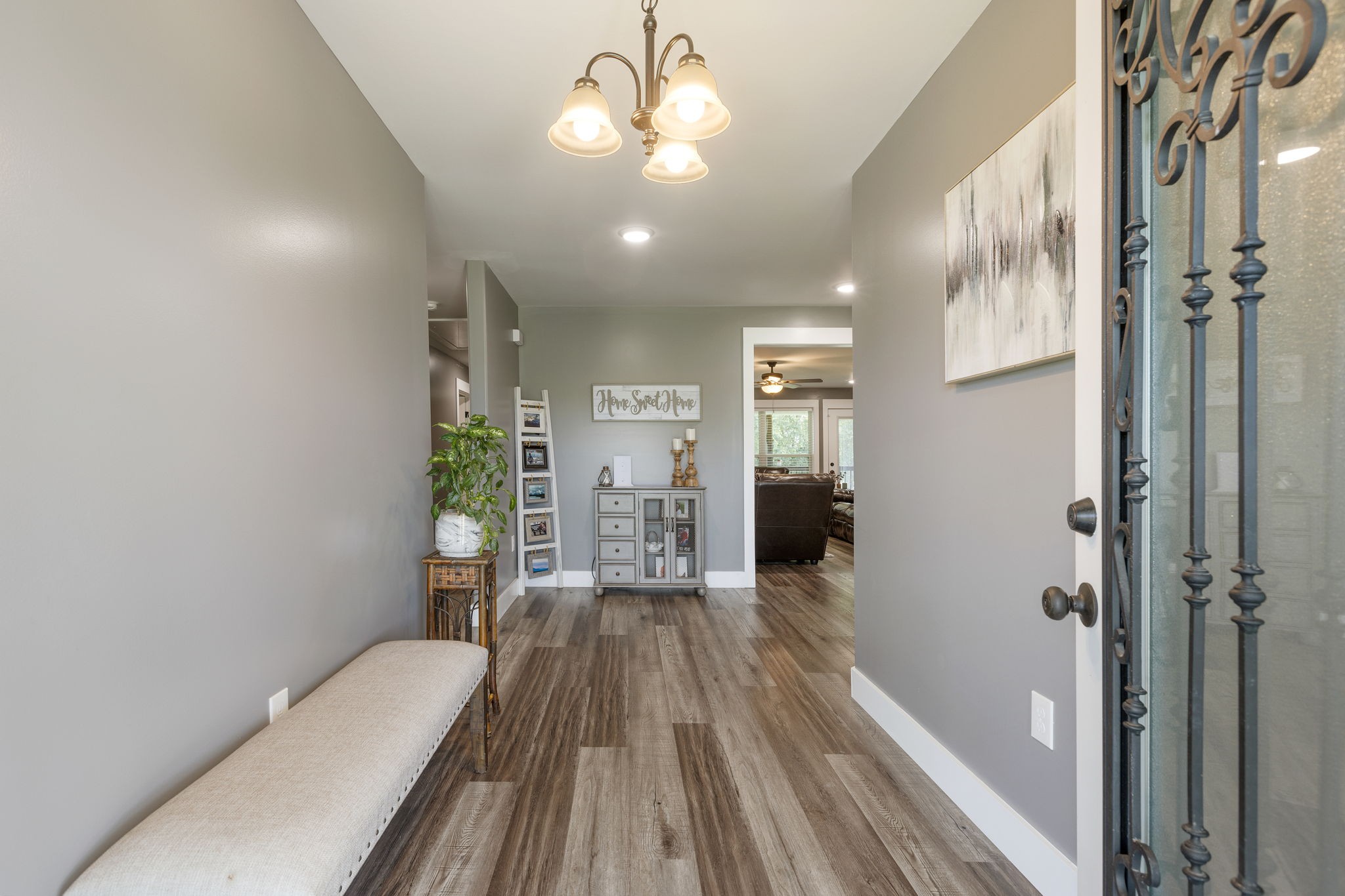 3030 Cherry Corner Road Cornersville, TN 37047 - Photo 20 of 66 a view of a hallway with wooden floor and a bathroom