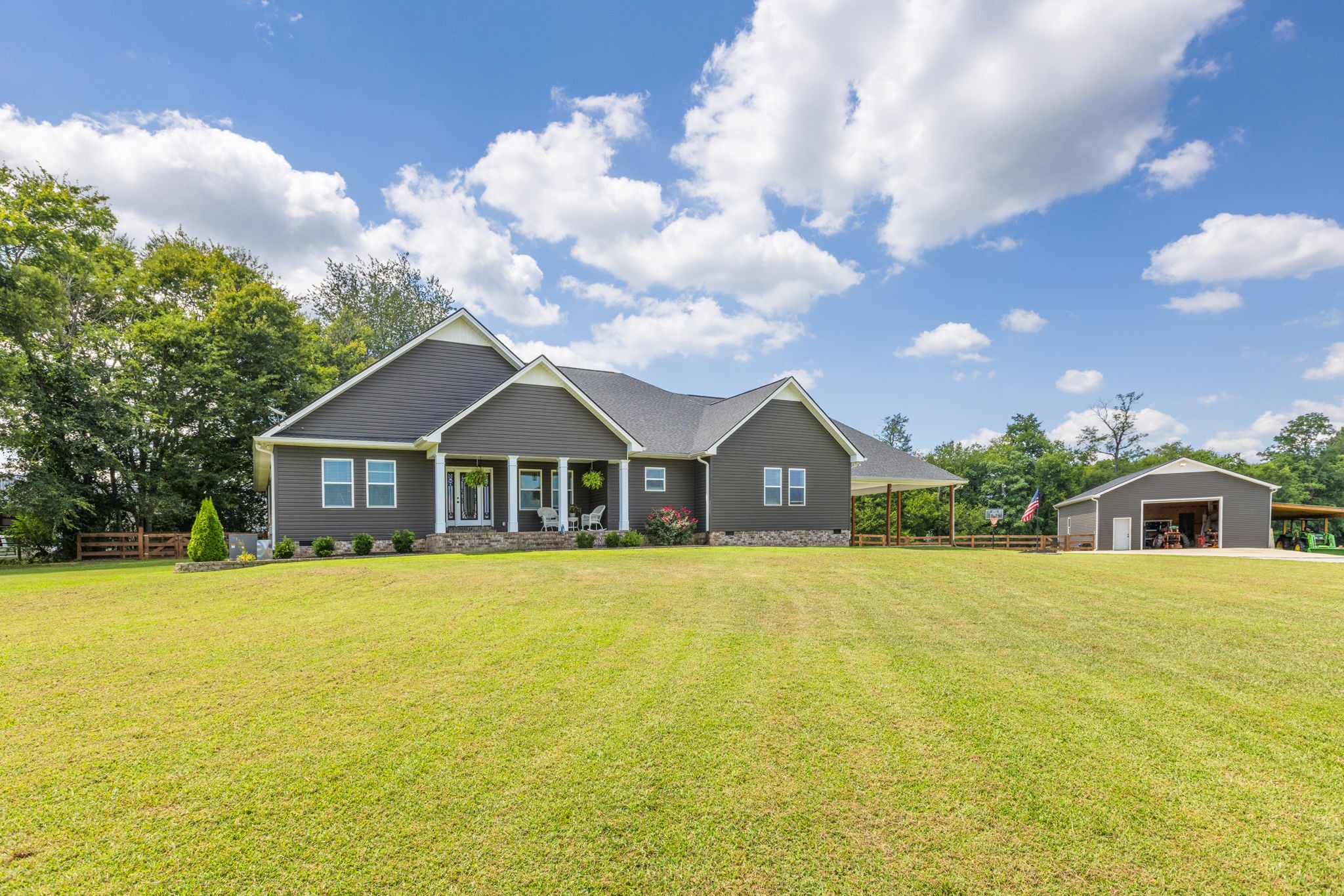 3030 Cherry Corner Road Cornersville, TN 37047 - Photo 2 of 66 a front view of a house with a yard