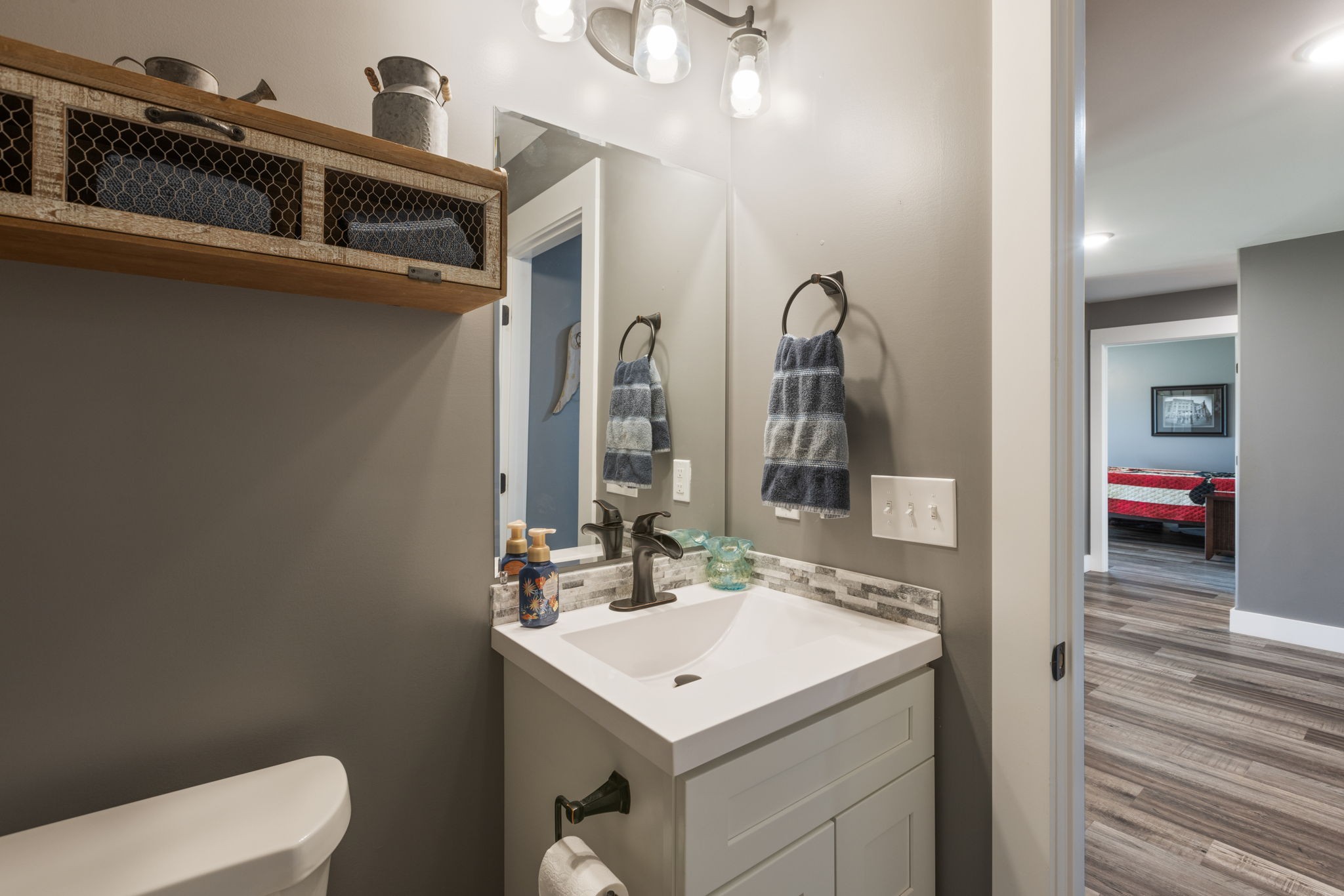 3030 Cherry Corner Road Cornersville, TN 37047 - Photo 22 of 66 a bathroom with a toilet sink and mirror