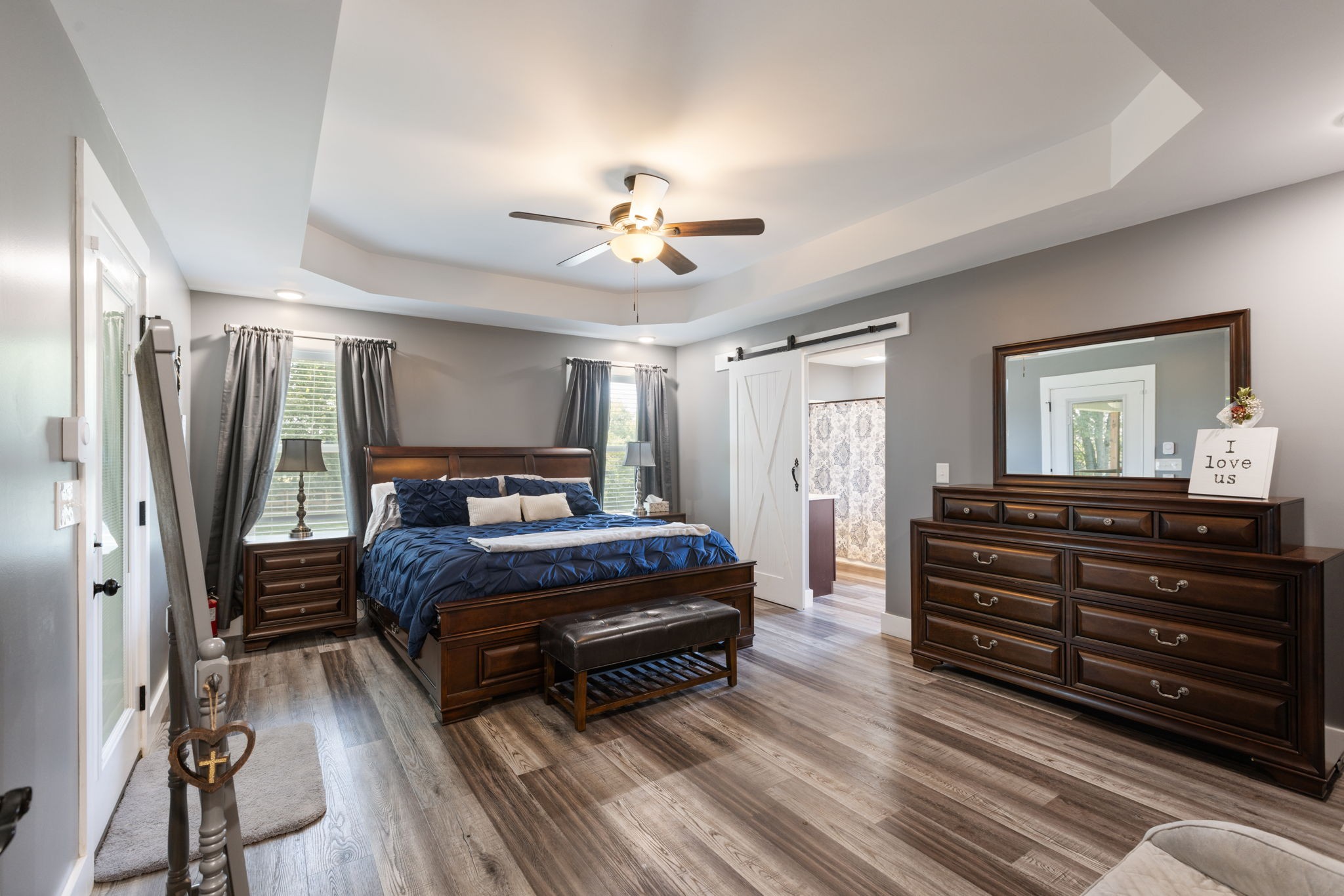 3030 Cherry Corner Road Cornersville, TN 37047 - Photo 24 of 66 a bedroom with a bed lamp and a chandelier