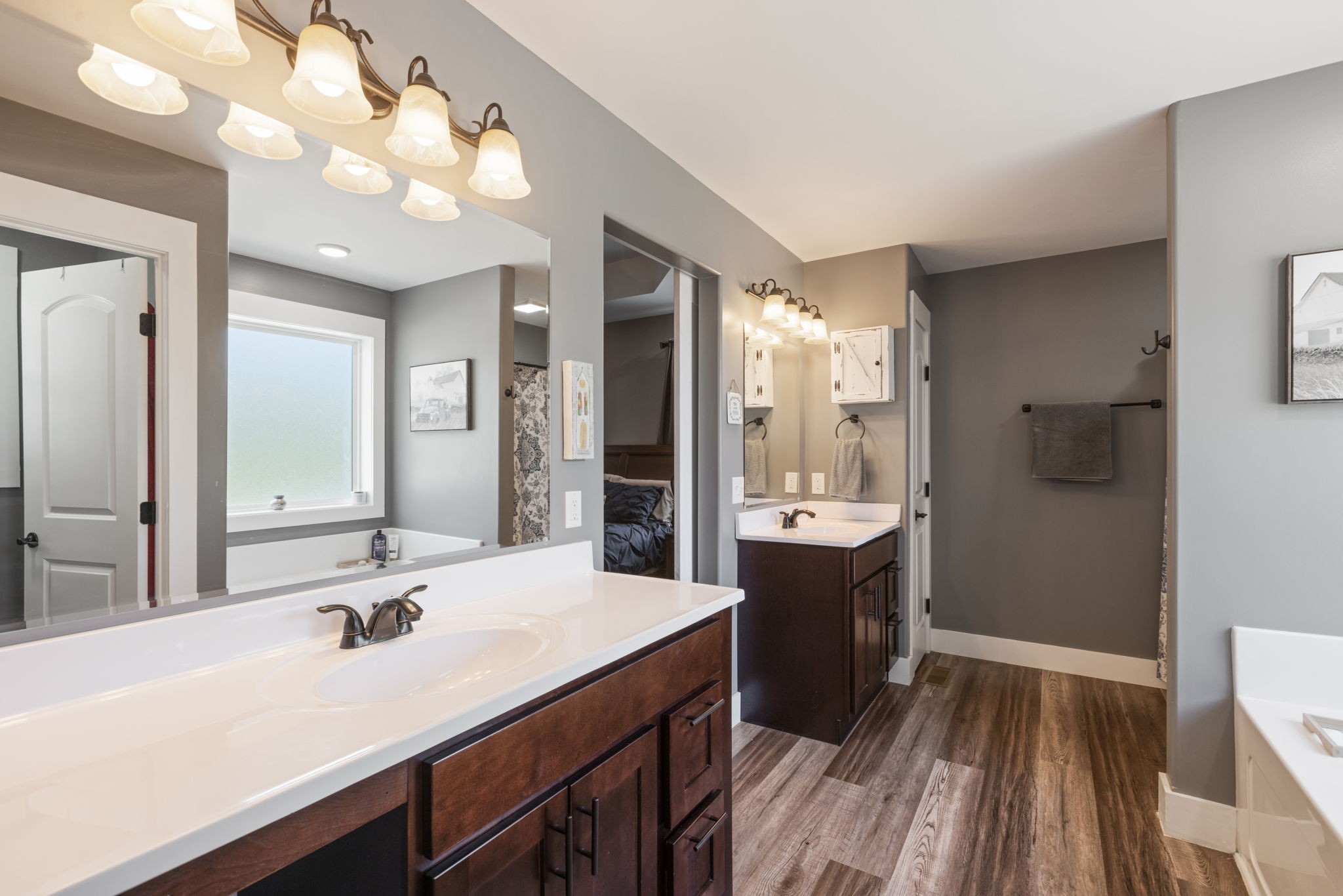 3030 Cherry Corner Road Cornersville, TN 37047 - Photo 28 of 66 a bathroom with a sink double vanity granite and a large mirror