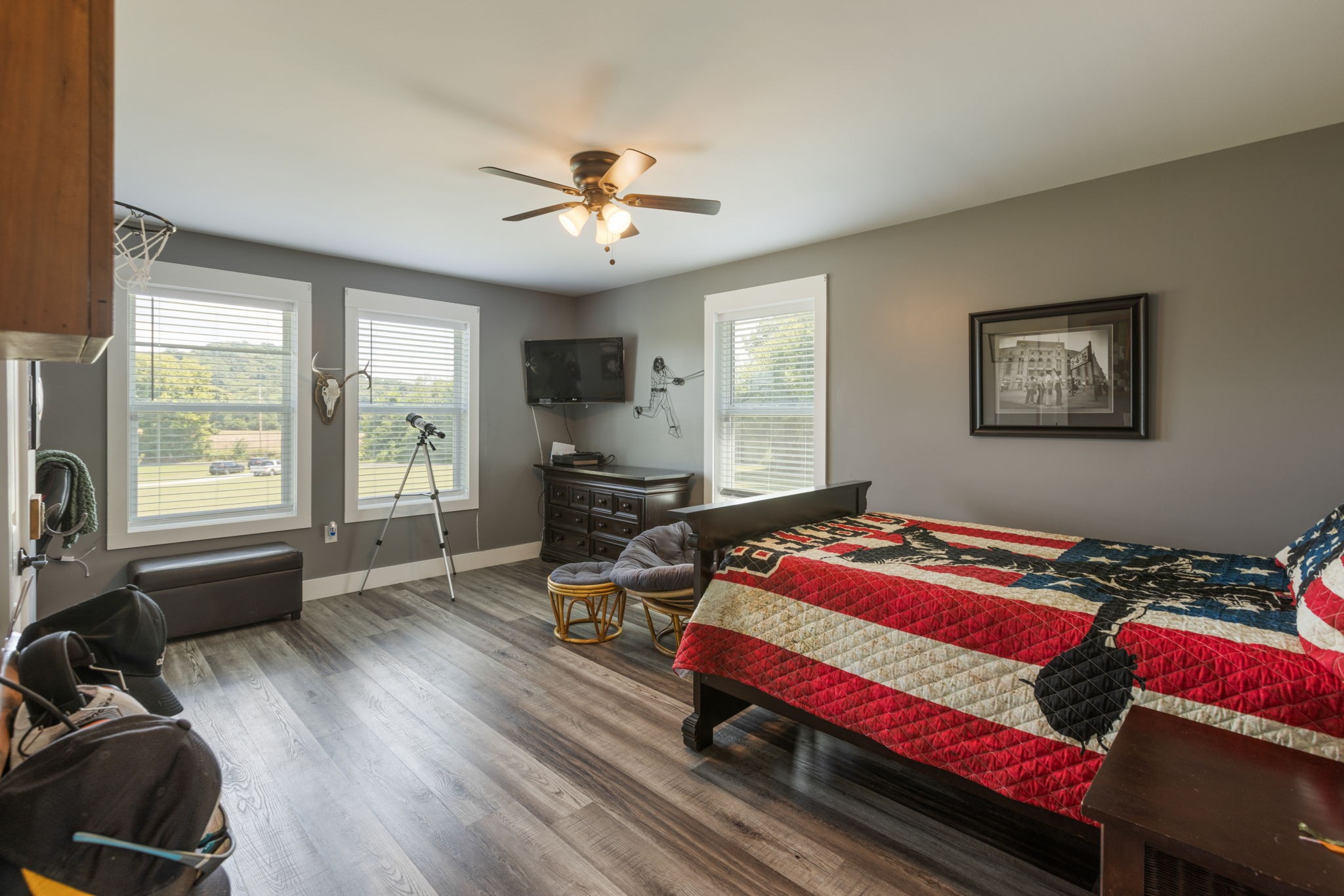 3030 Cherry Corner Road Cornersville, TN 37047 - Photo 37 of 66 a bedroom with a bed and a chandelier