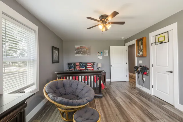 a view of a house with swimming pool and sitting area