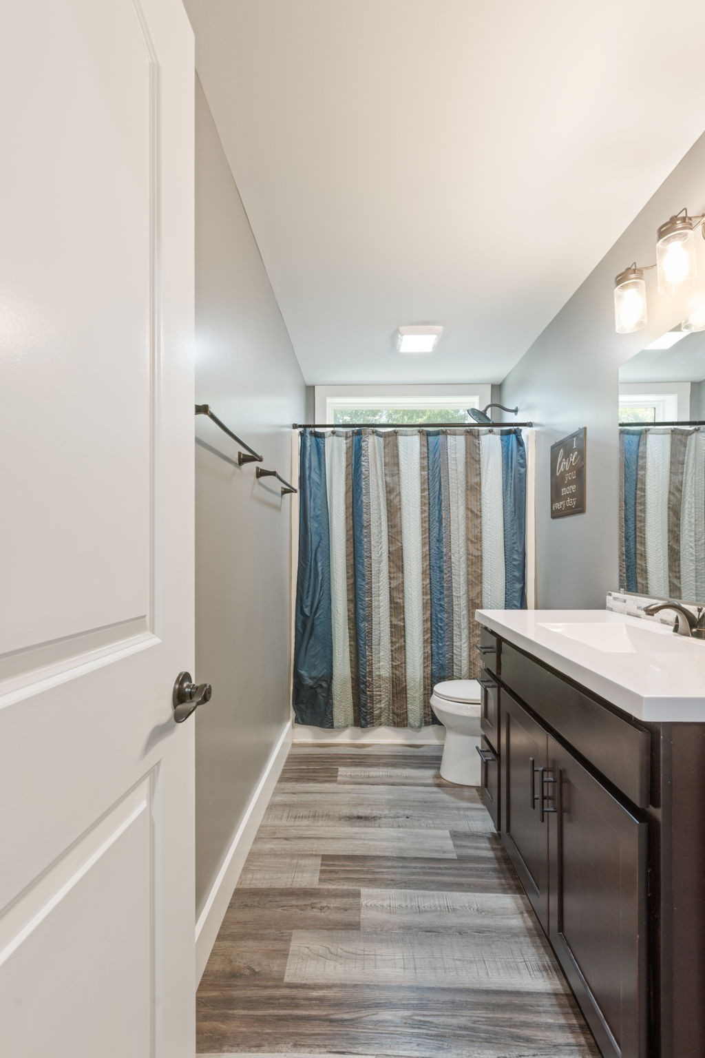 3030 Cherry Corner Road Cornersville, TN 37047 - Photo 42 of 66 a spacious bathroom with a granite countertop sink and a mirror