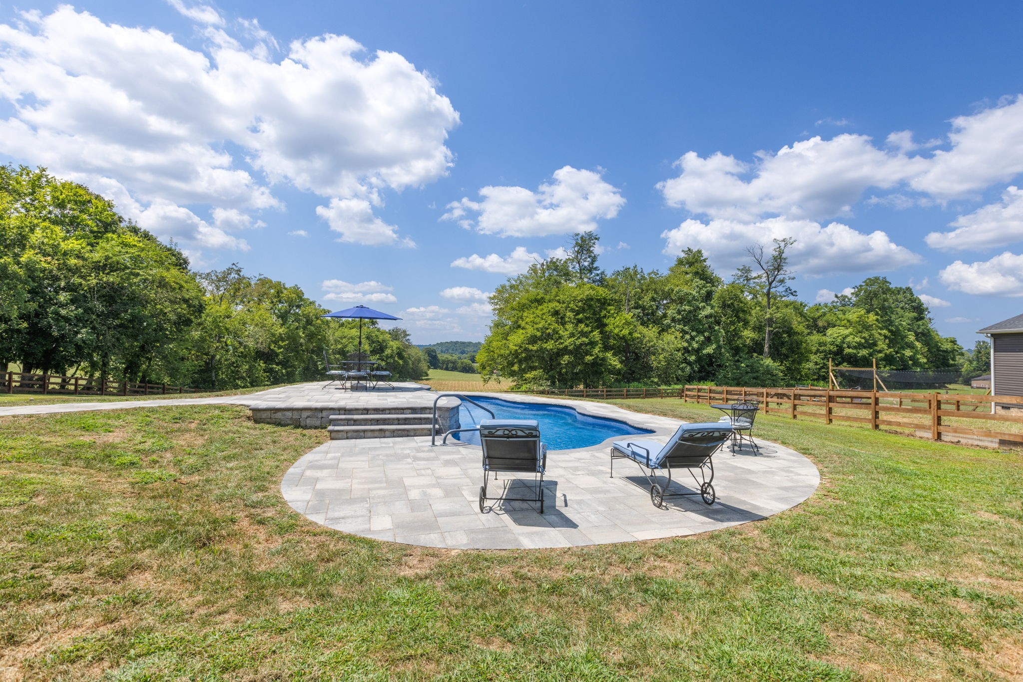 3030 Cherry Corner Road Cornersville, TN 37047 - Photo 5 of 66 a view of a swimming pool with a yard