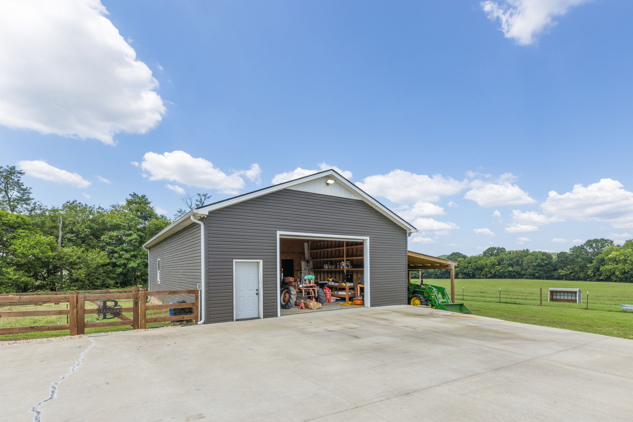 3030 Cherry Corner Road Cornersville, TN 37047 - Photo 51 of 66 a front view of a house with a yard and garage