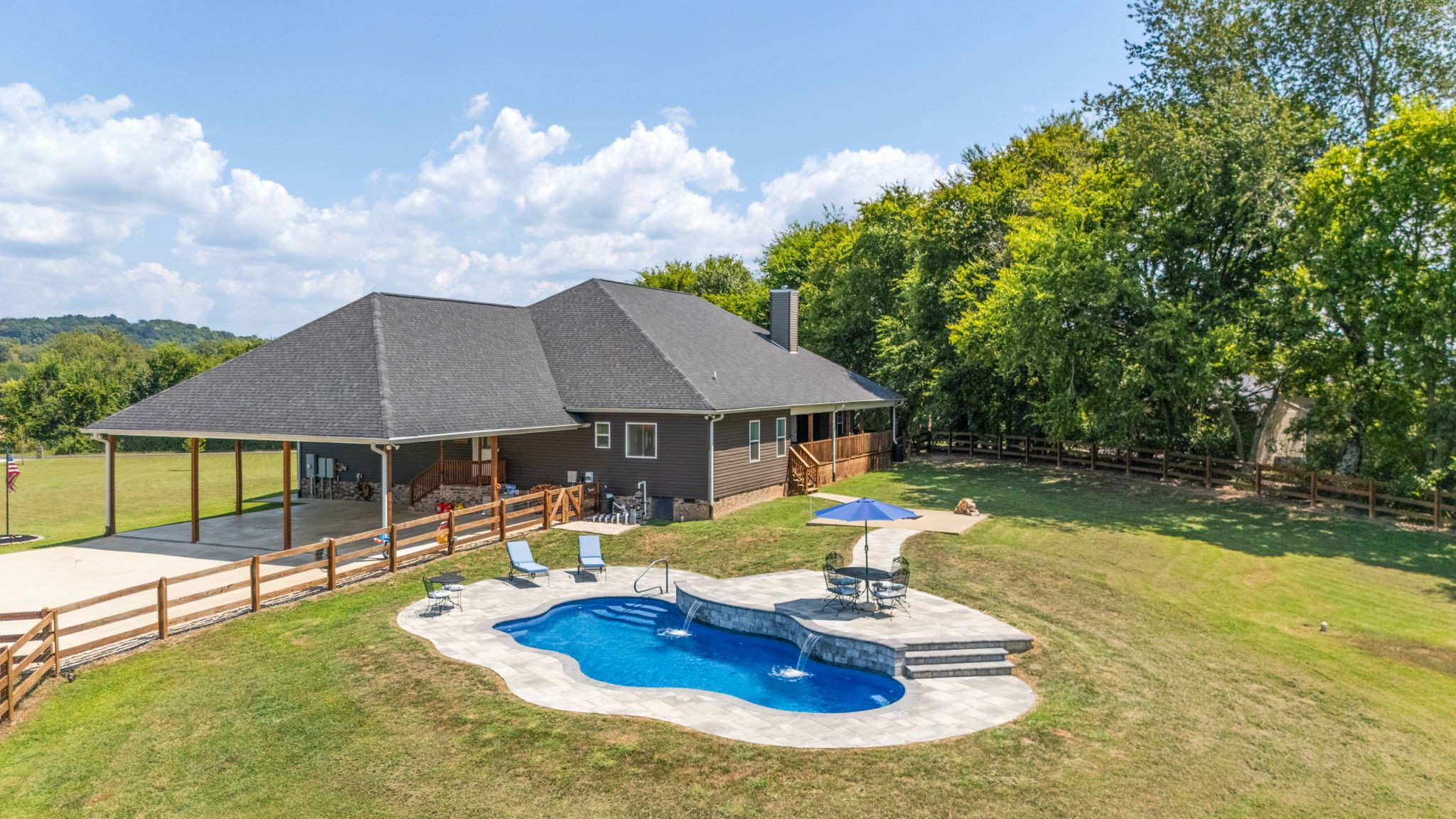3030 Cherry Corner Road Cornersville, TN 37047 - Photo 56 of 66 a view of a house with swimming pool and sitting area