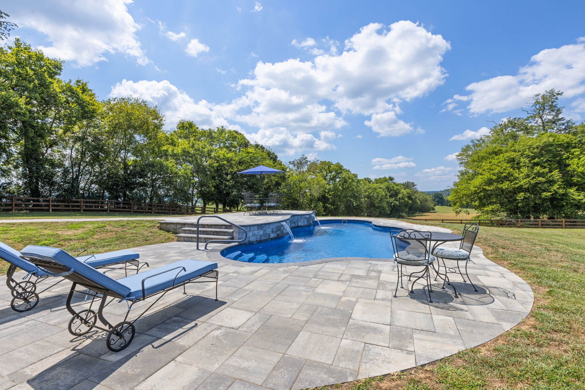 3030 Cherry Corner Road Cornersville, TN 37047 - Photo 6 of 66 a view of swimming pool with seating space and trees in the background