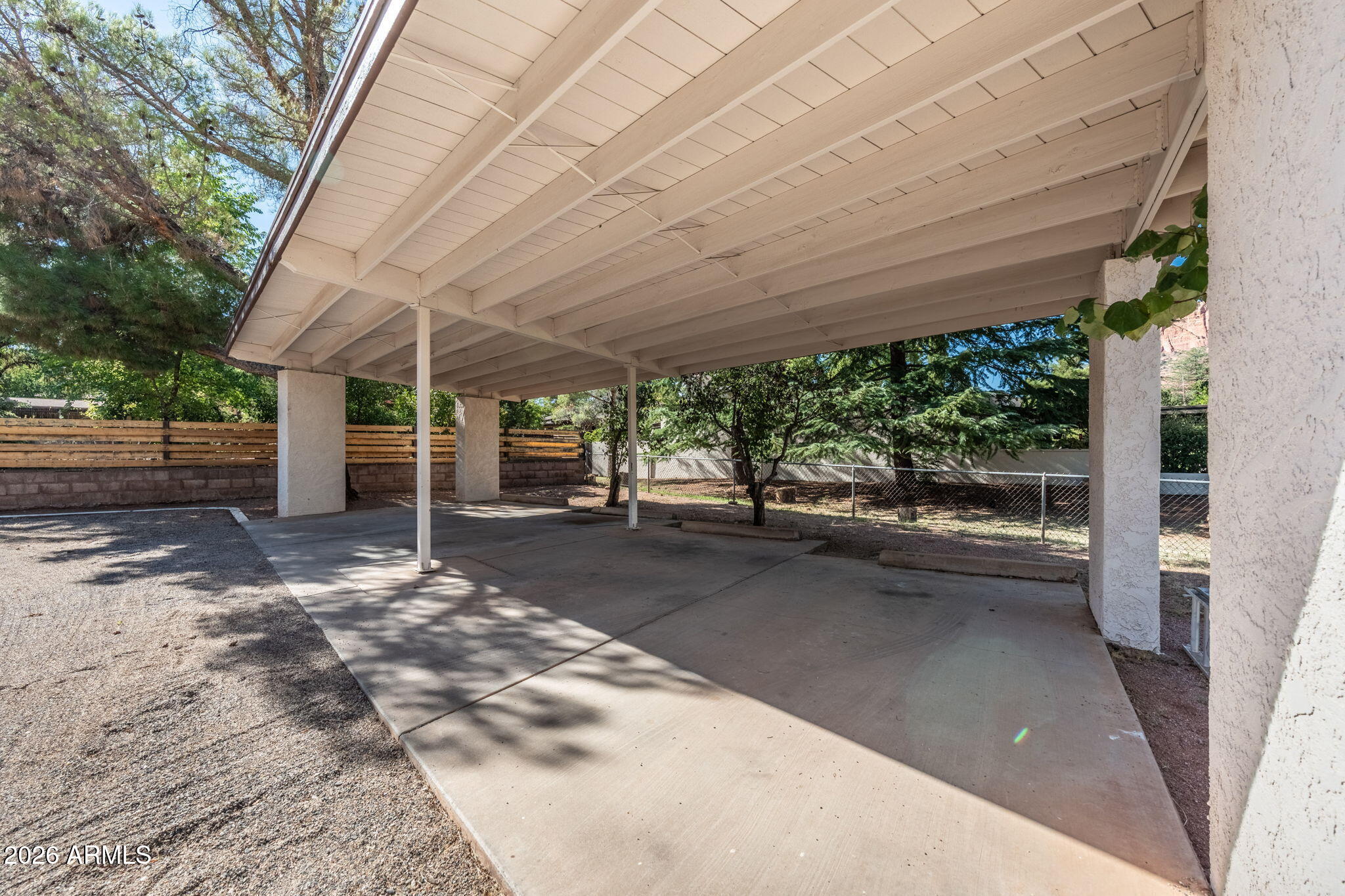 615 Jordan Road Sedona, AZ 86336 - Photo 11 of 88 a view of a patio with table and chairs under an umbrella