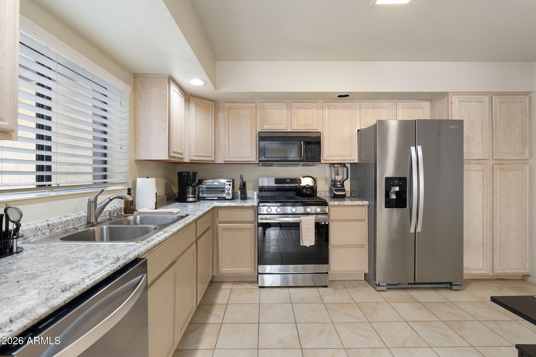 615 Jordan Road Sedona, AZ 86336 - Photo 13 of 82 a kitchen with stainless steel appliances granite countertop a refrigerator sink and stove