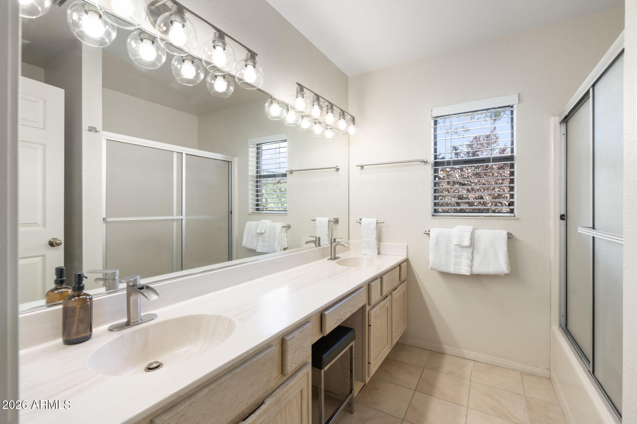 615 Jordan Road Sedona, AZ 86336 - Photo 23 of 82 a bathroom with a sink a vanity and a mirror