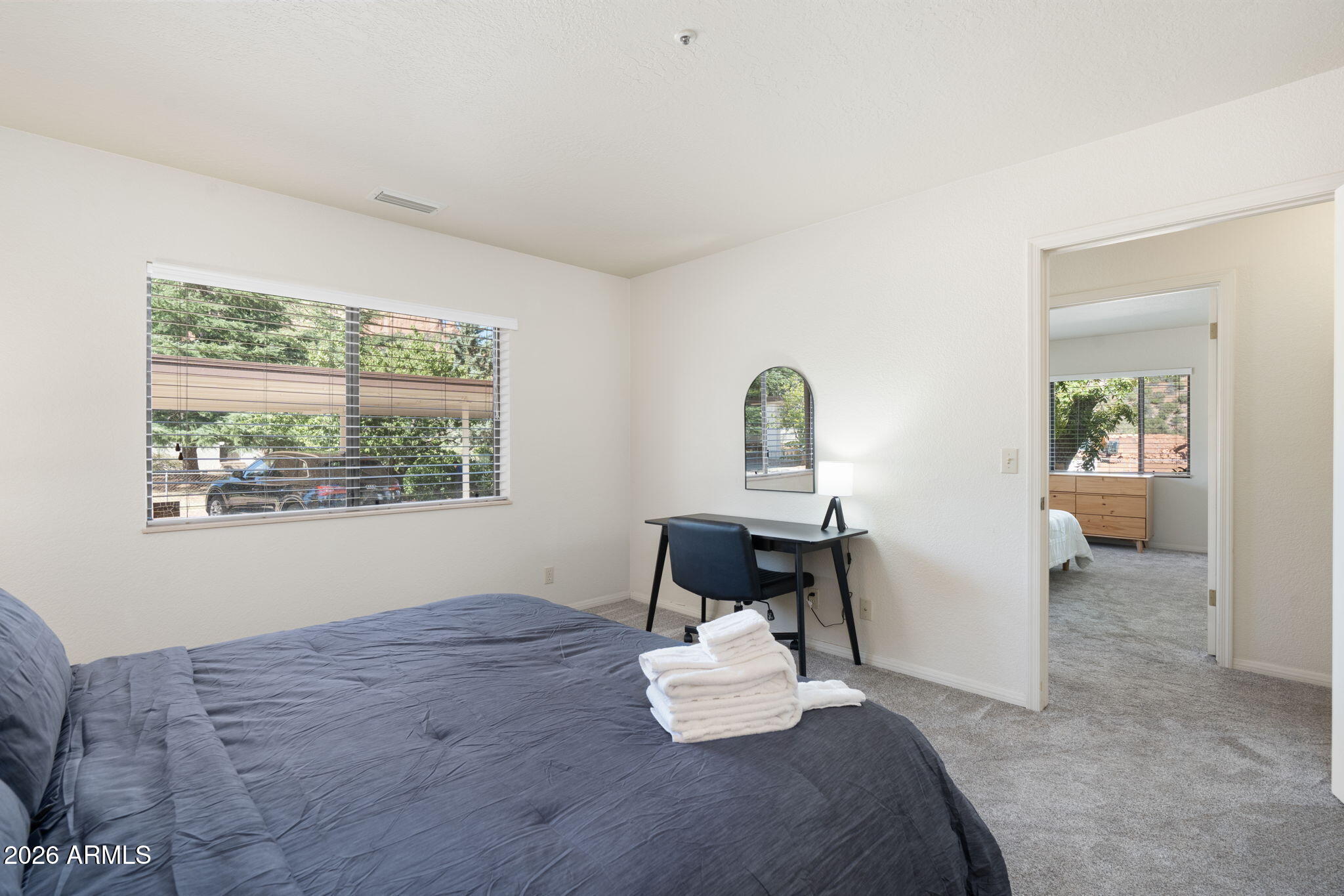 615 Jordan Road Sedona, AZ 86336 - Photo 25 of 88 a bedroom with a bed and a window