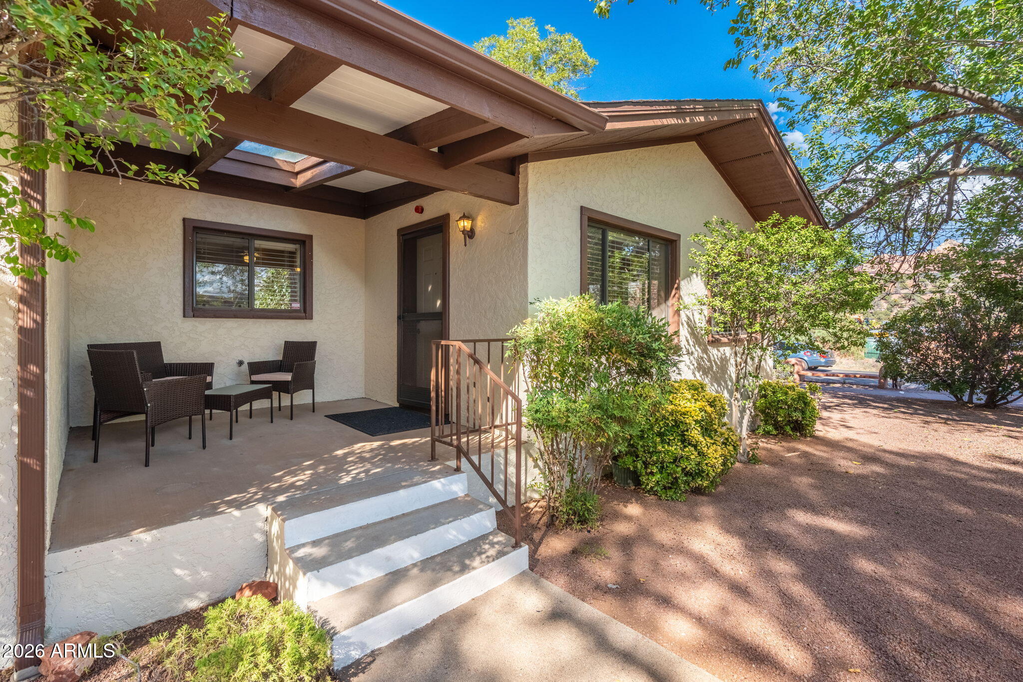 615 Jordan Road Sedona, AZ 86336 - Photo 26 of 82 a view of a patio with table and chairs and potted plants