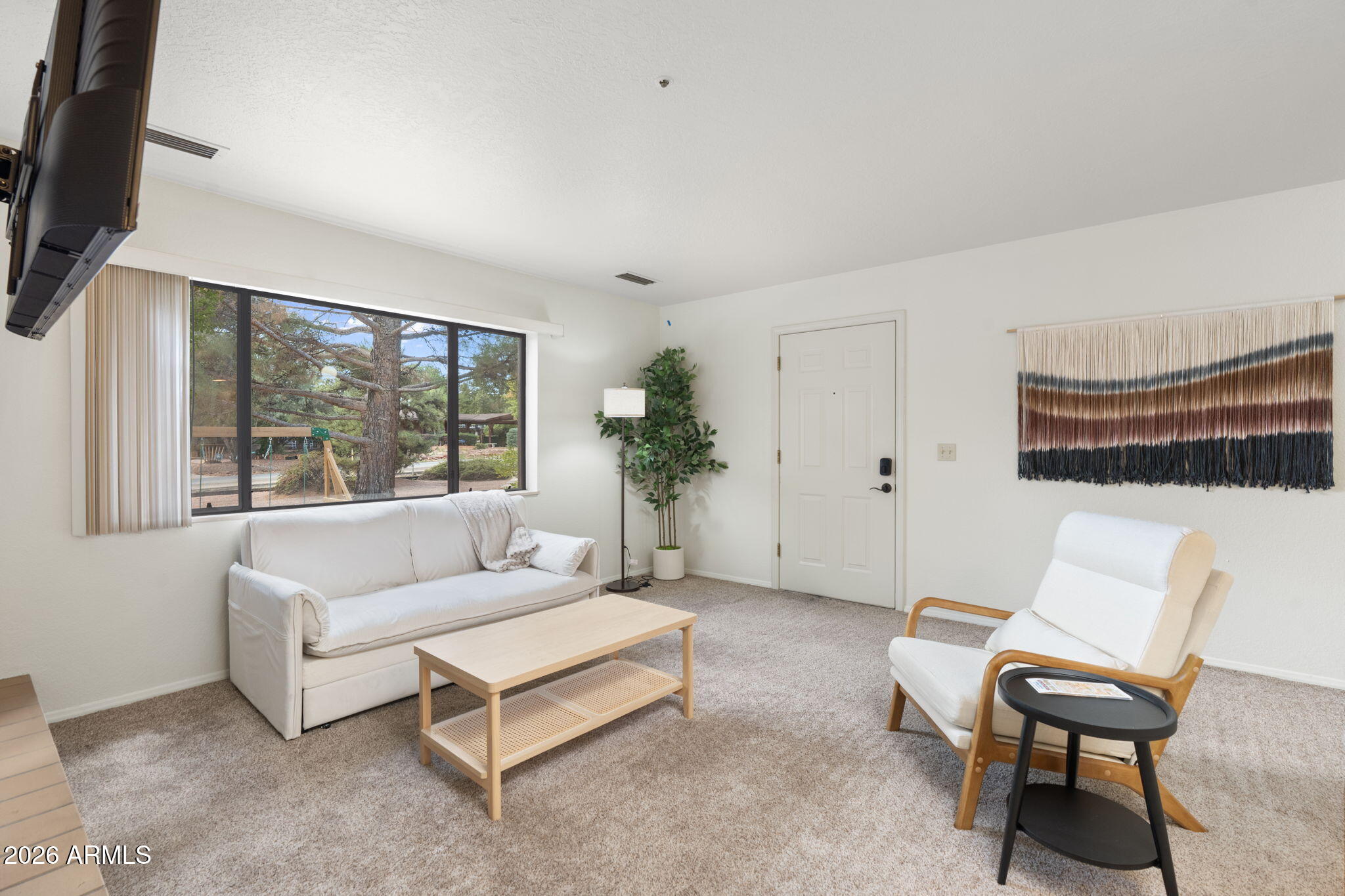 615 Jordan Road Sedona, AZ 86336 - Photo 38 of 88 a living room with furniture and a large window