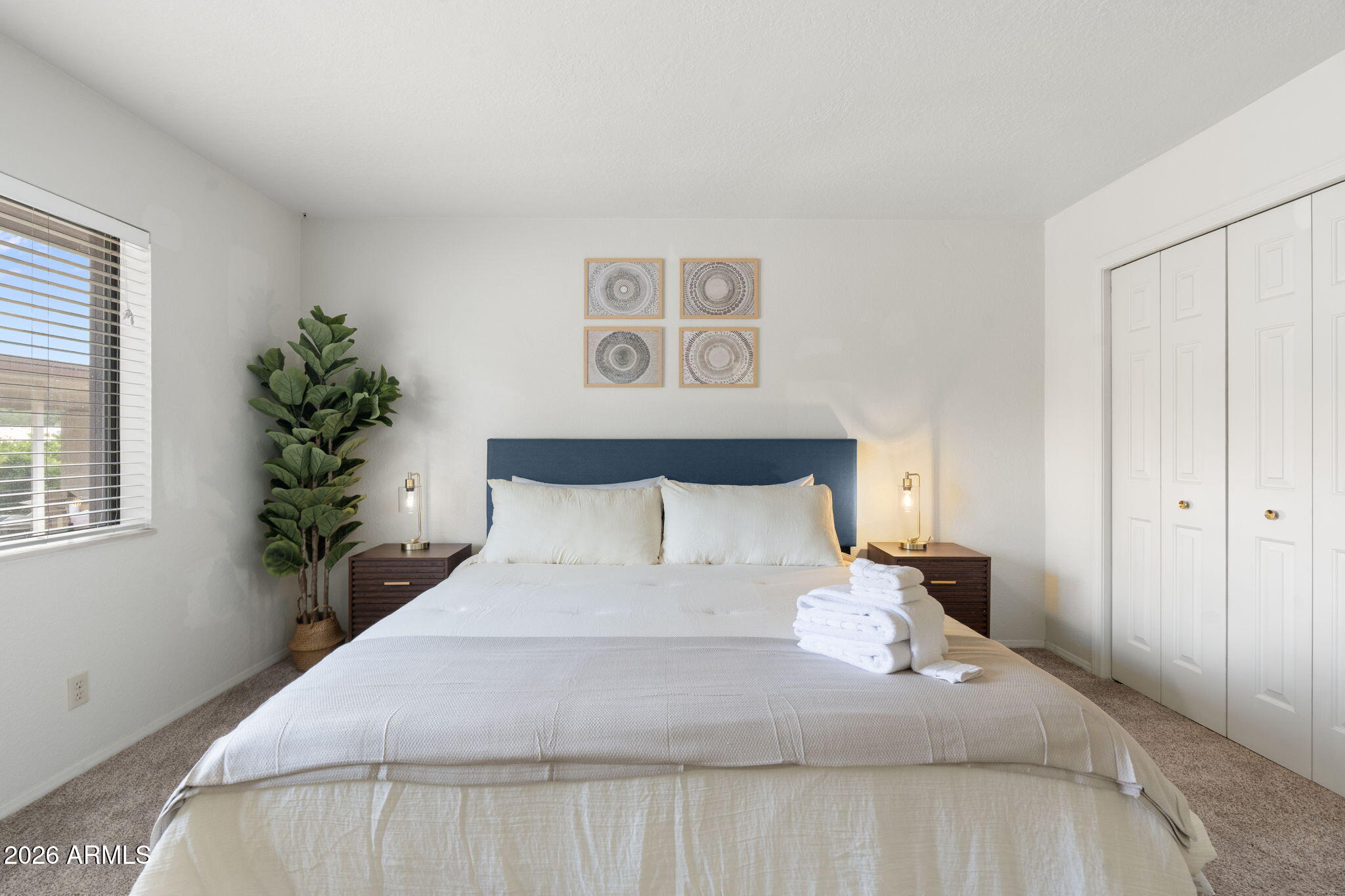 615 Jordan Road Sedona, AZ 86336 - Photo 39 of 82 a large bed sitting in a bedroom next to a window and a potted plant