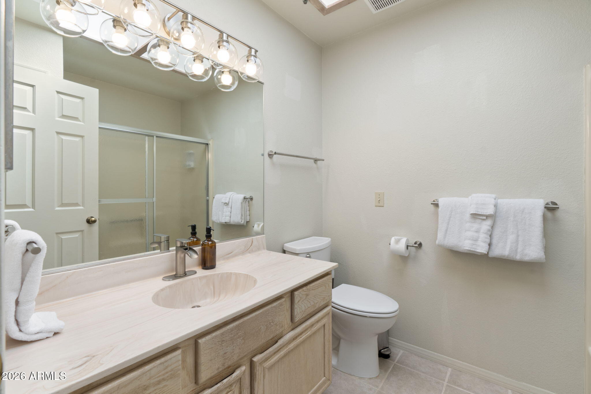 615 Jordan Road Sedona, AZ 86336 - Photo 47 of 88 a bathroom with a toilet a sink and mirror