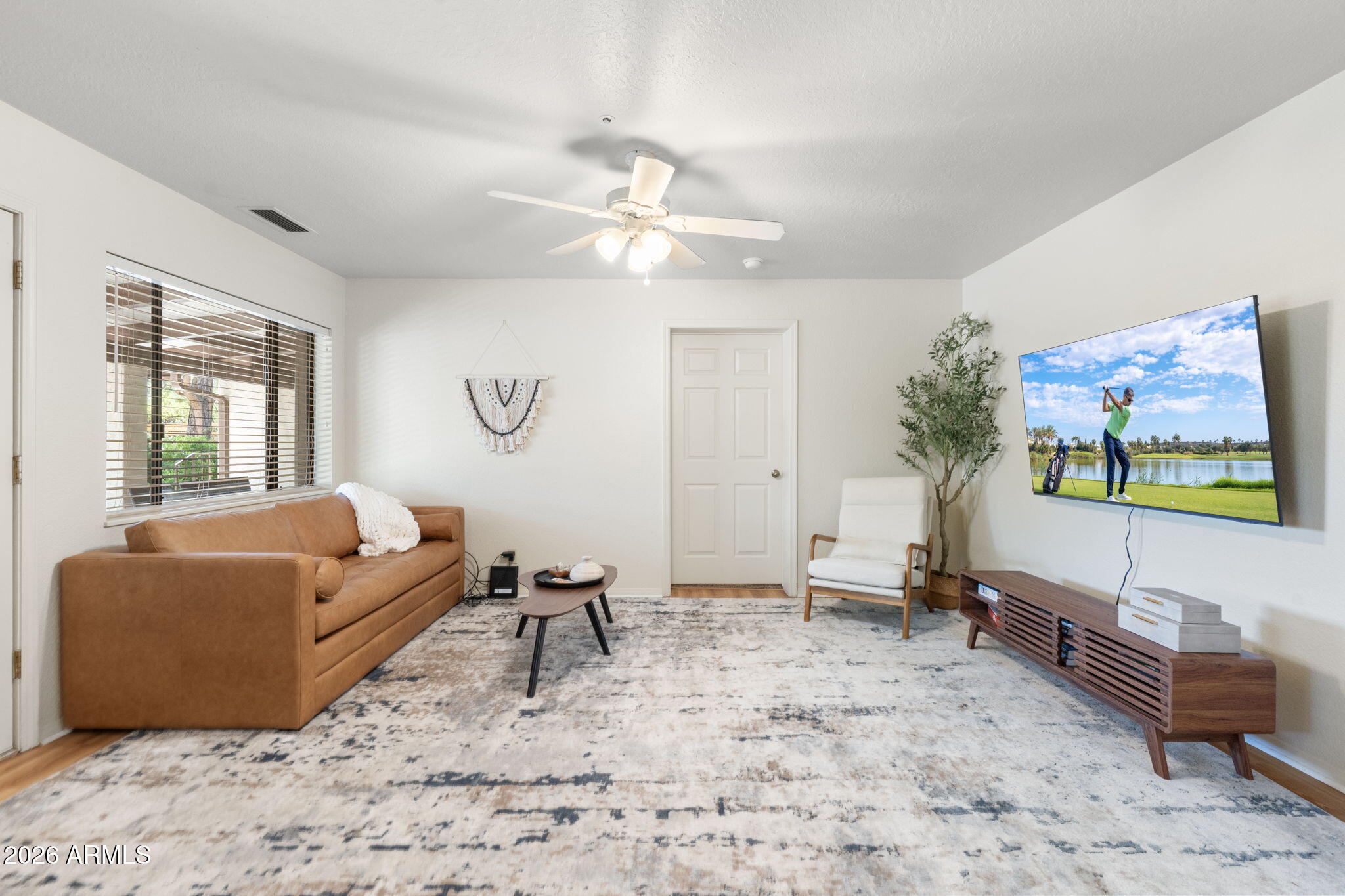 615 Jordan Road Sedona, AZ 86336 - Photo 47 of 82 a living room with furniture and a flat screen tv