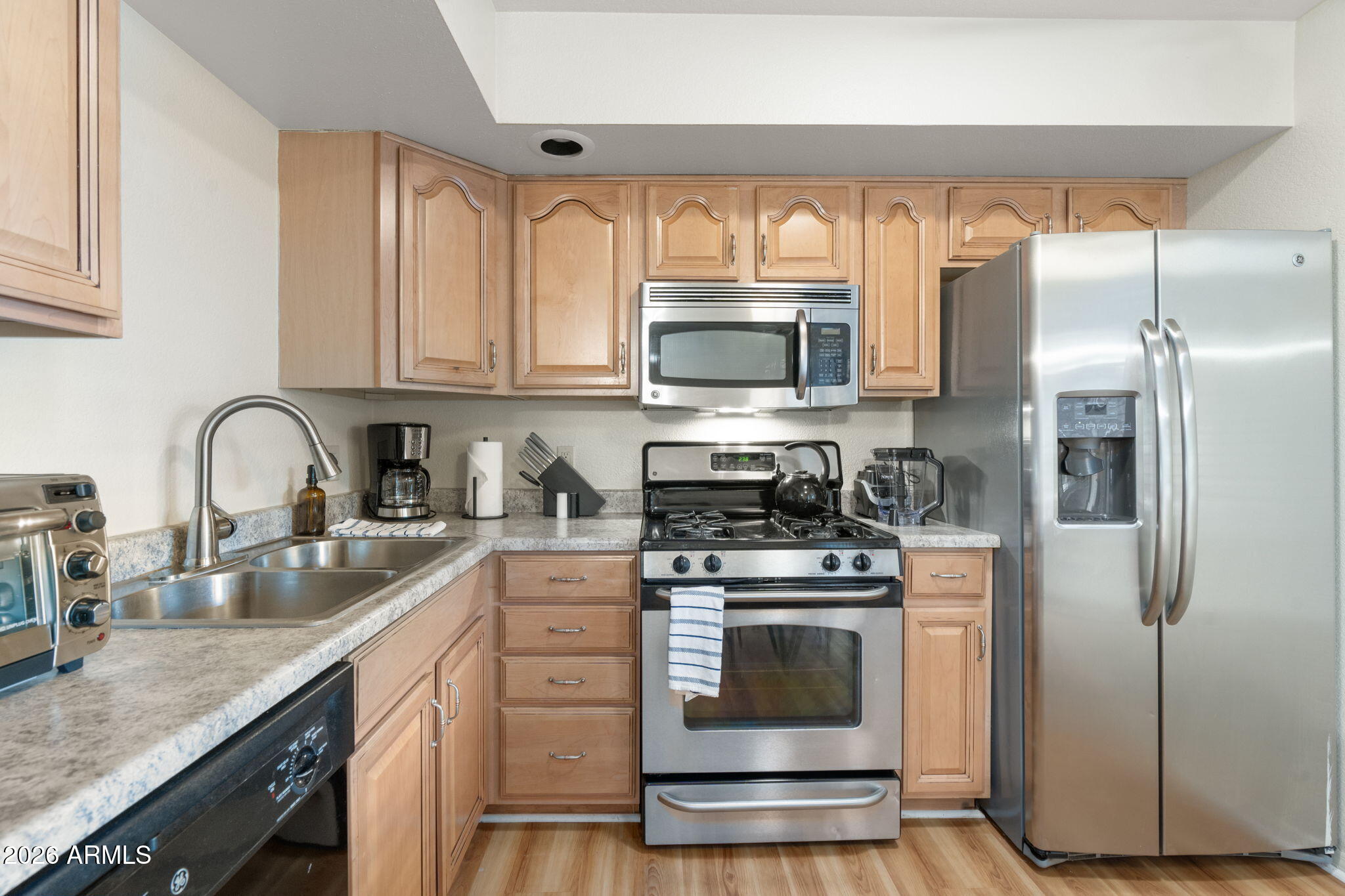 615 Jordan Road Sedona, AZ 86336 - Photo 52 of 82 a kitchen with stainless steel appliances granite countertop a stove a sink dishwasher a refrigerator and a microwave