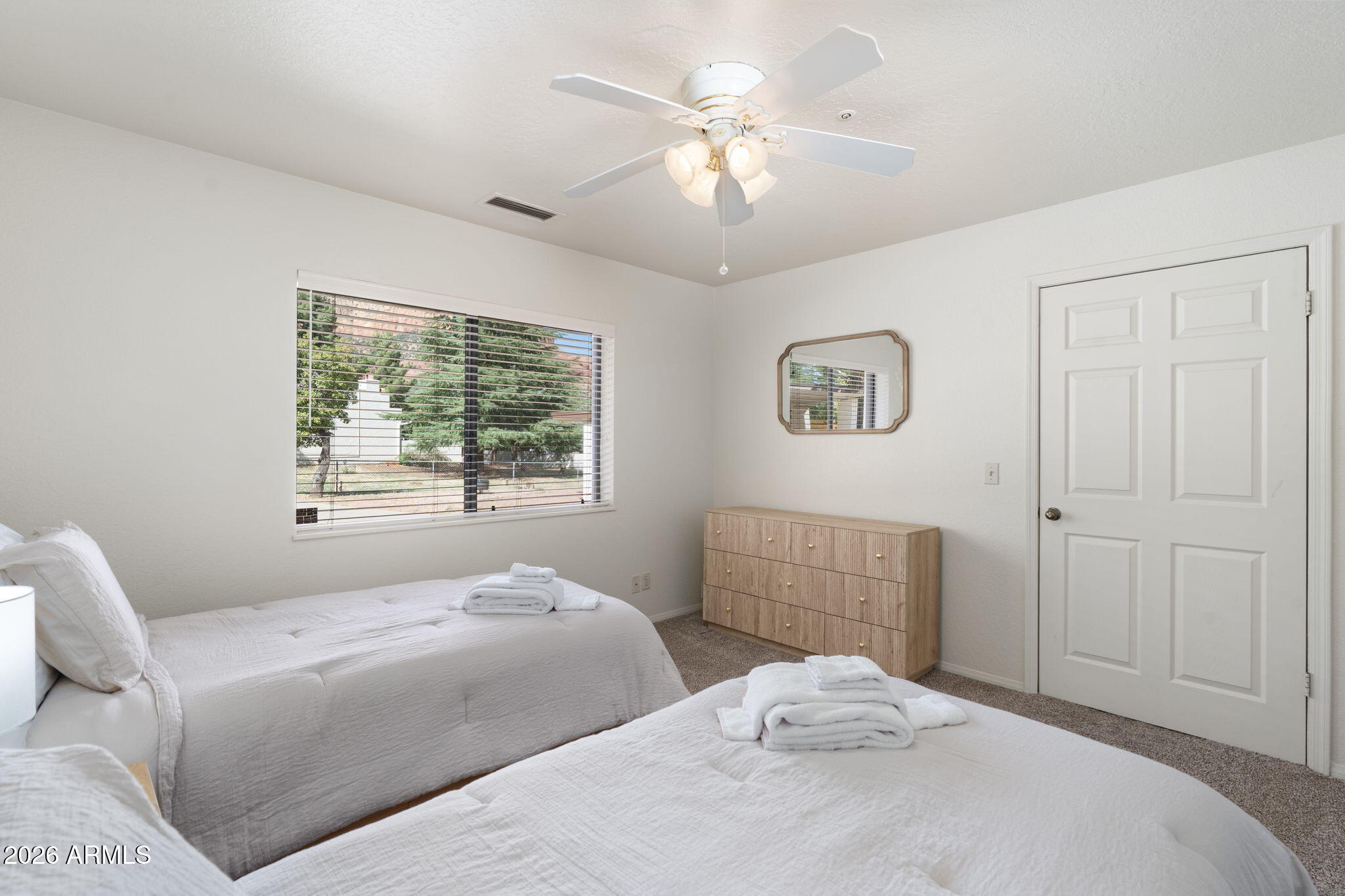 615 Jordan Road Sedona, AZ 86336 - Photo 55 of 82 a bedroom with a large bed and a window