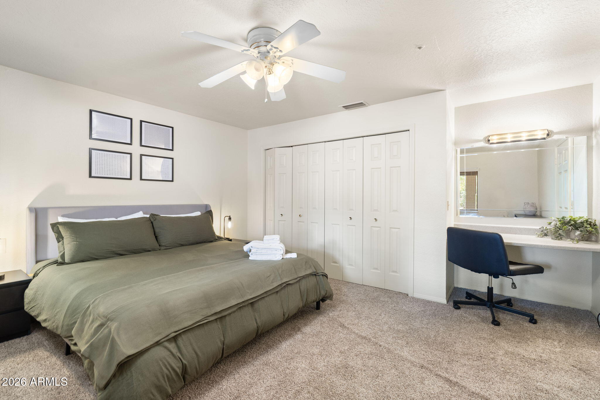 615 Jordan Road Sedona, AZ 86336 - Photo 59 of 82 a bedroom with a bed and a chandelier