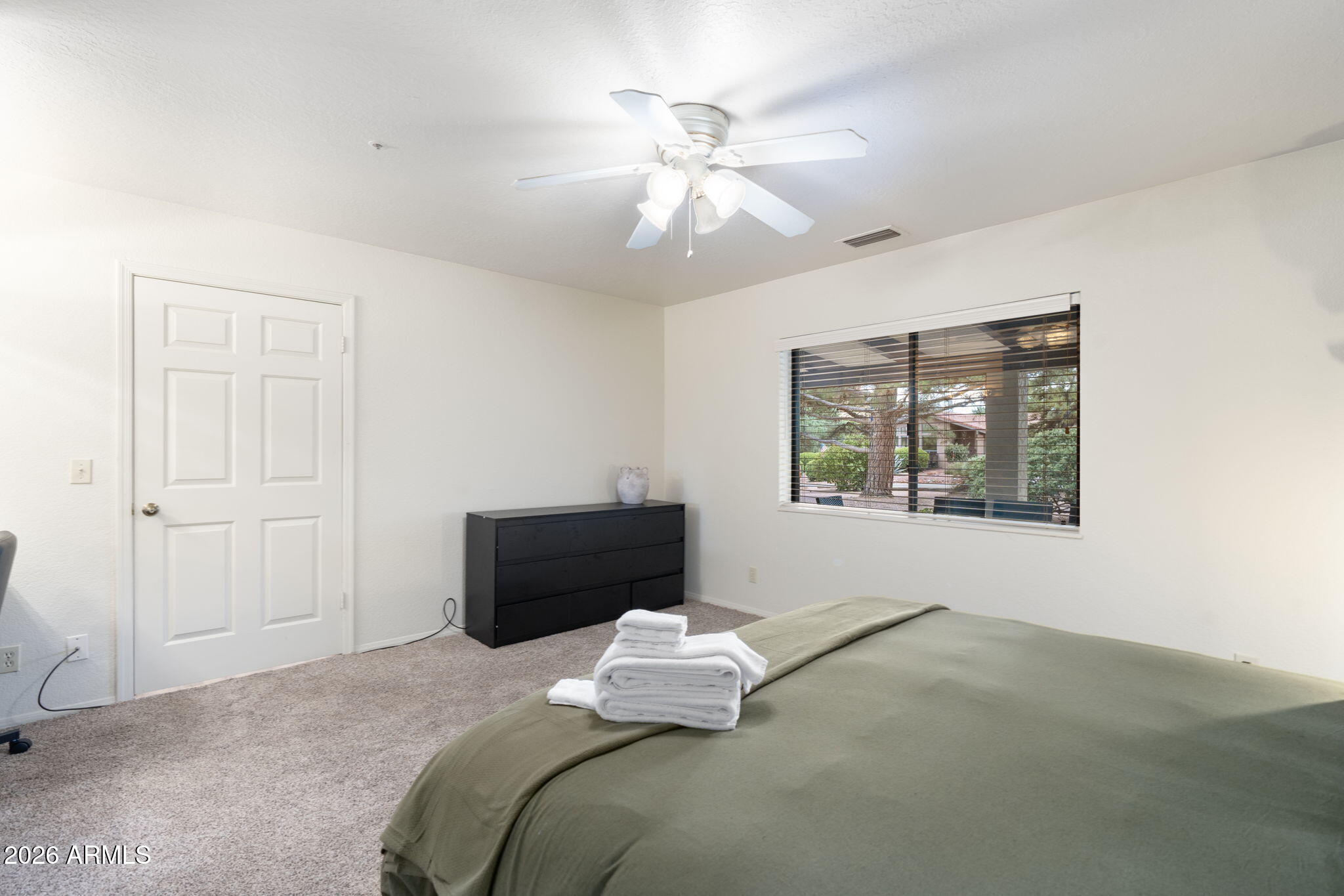 615 Jordan Road Sedona, AZ 86336 - Photo 63 of 88 a bedroom with a bed and a window