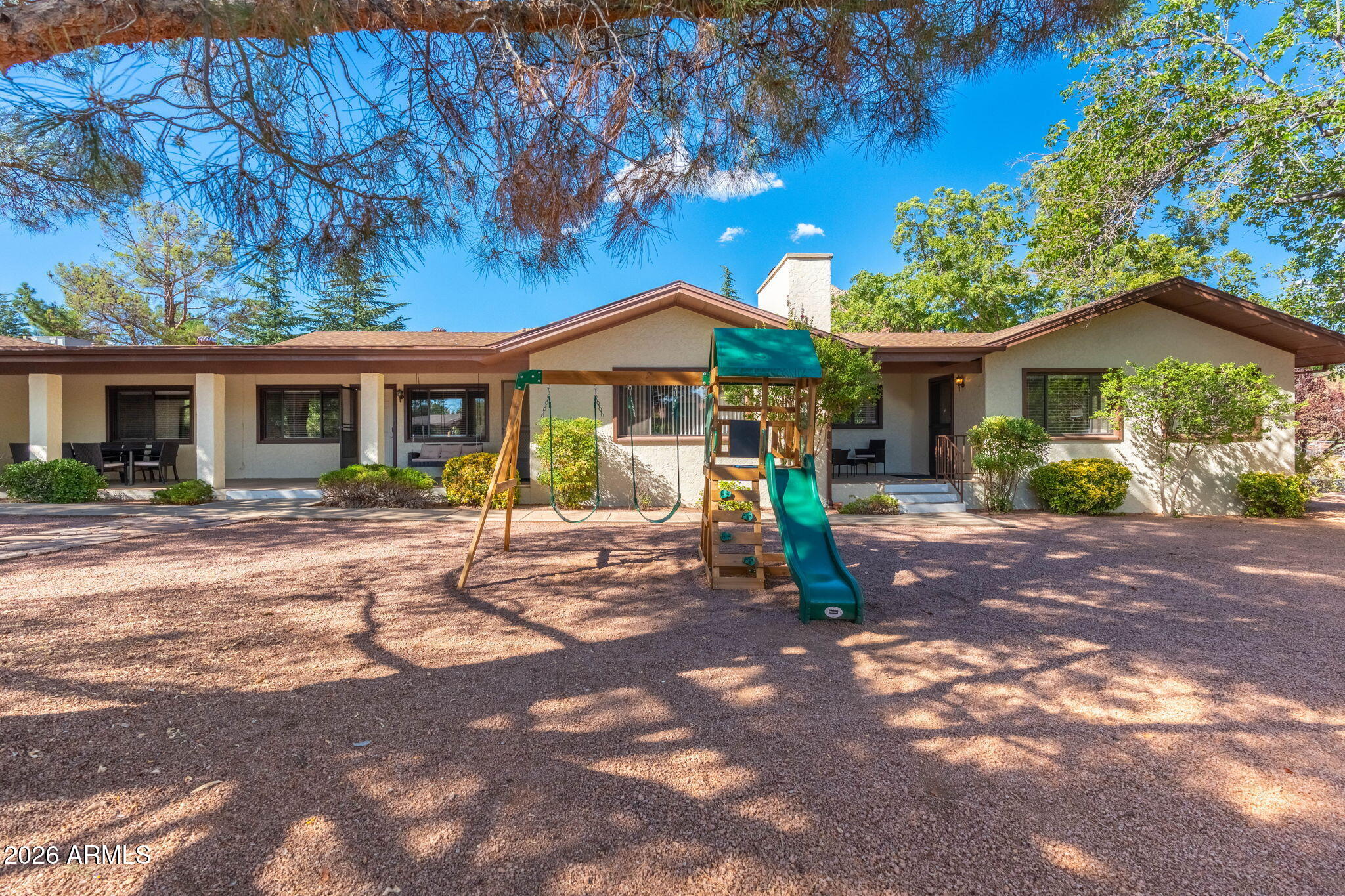 615 Jordan Road Sedona, AZ 86336 - Photo 81 of 82 a view of a house with a yard and plants