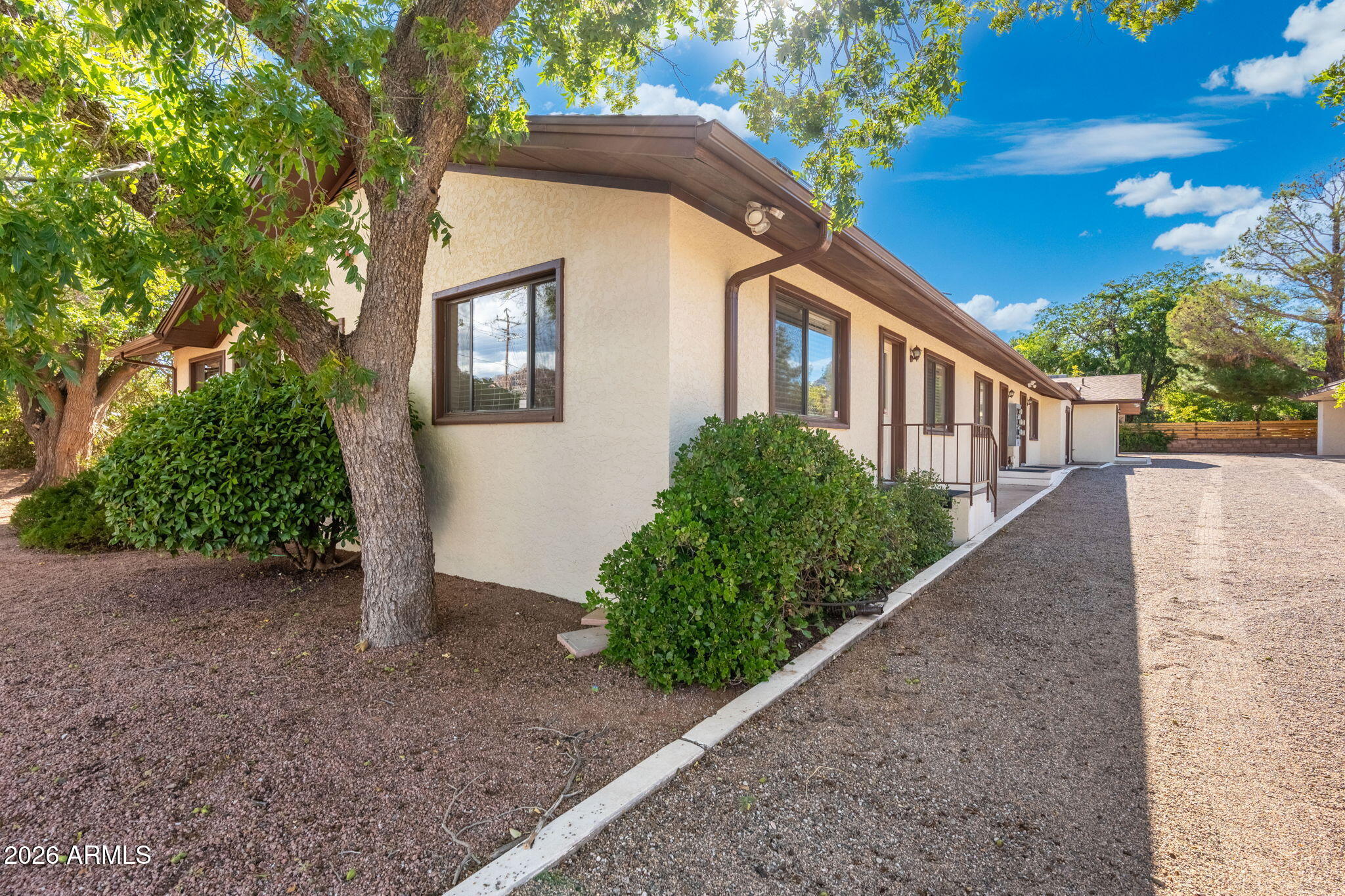 615 Jordan Road Sedona, AZ 86336 - Photo 10 of 88 a front view of a house with a yard