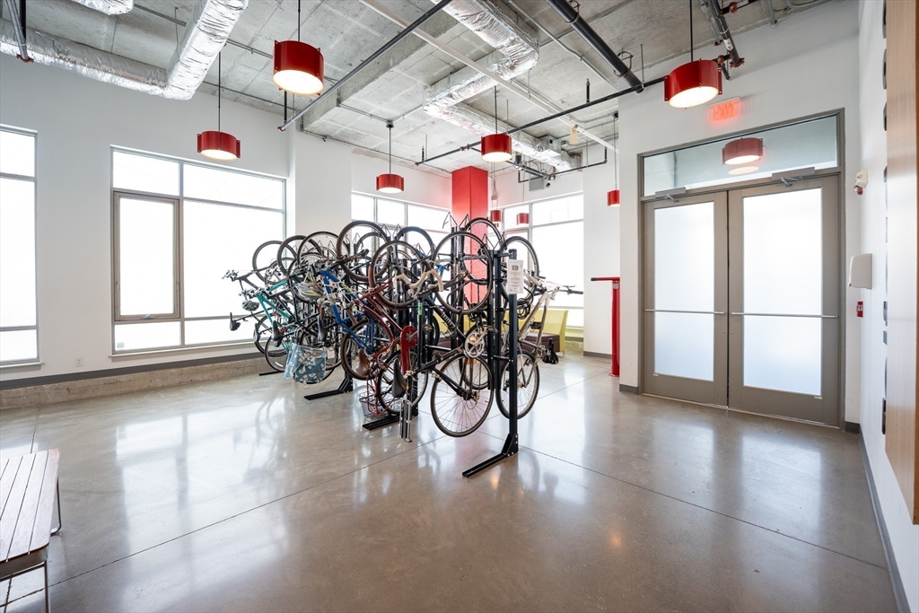 180 Telford Street, Unit 605 Boston, MA 02135 - Photo 19 of 24 a view of a room with lots of wooden floor