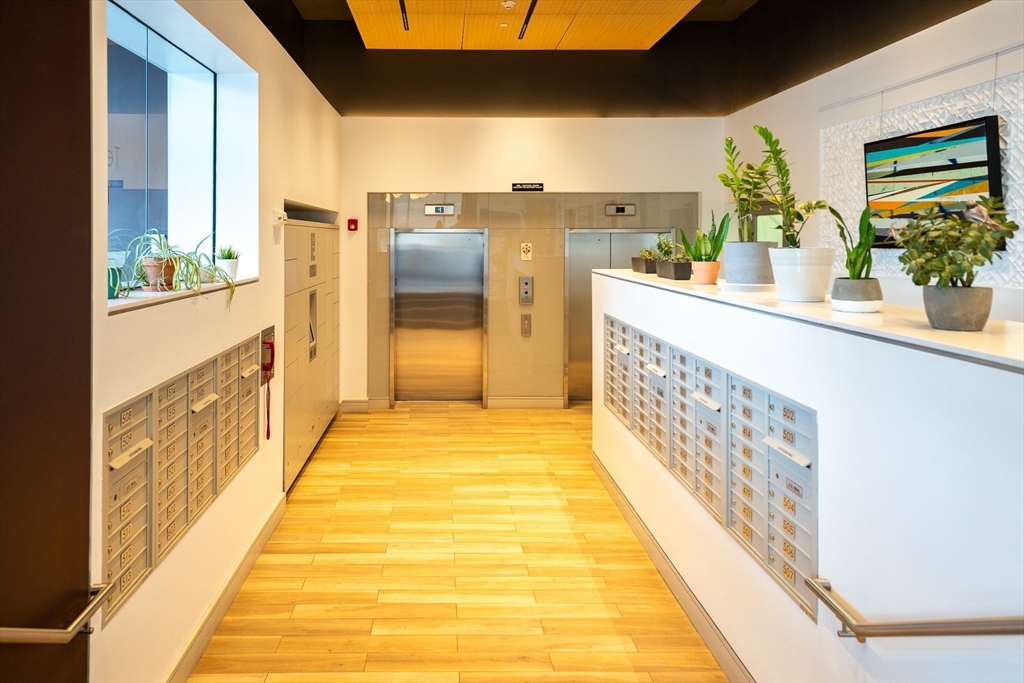 180 Telford Street, Unit 605 Boston, MA 02135 - Photo 3 of 24 a bathroom with a tub and shower
