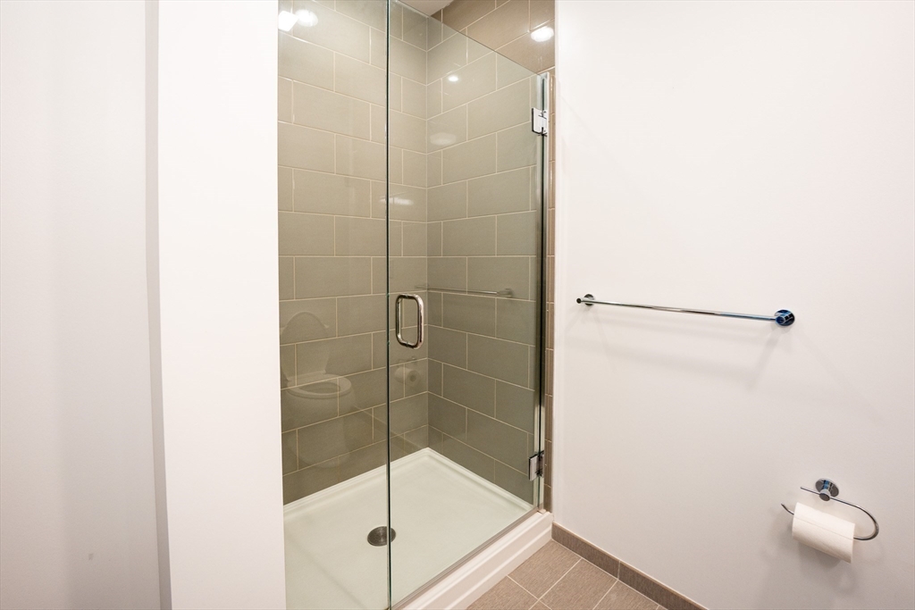 180 Telford Street, Unit 605 Boston, MA 02135 - Photo 10 of 24 a bathroom with a shower