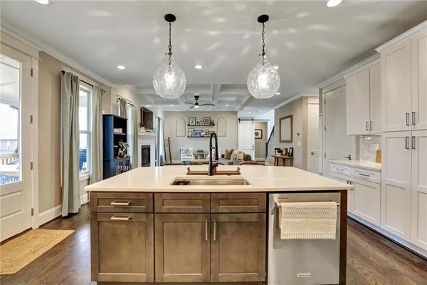 a bedroom with a large bed couch and a window