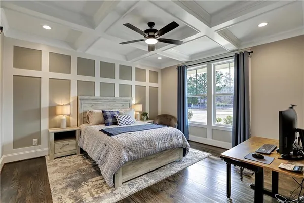 a living room with a bed furniture and a window