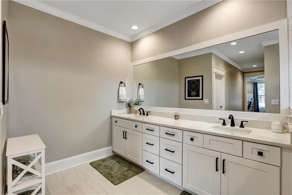 a bedroom with a bed and a ceiling fan