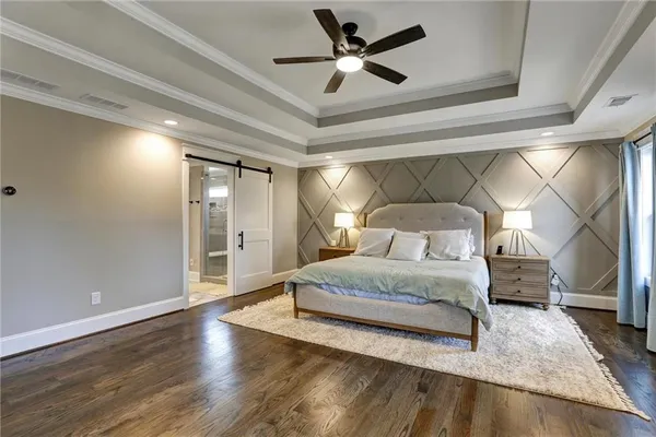 a view of walk in closet with clothes