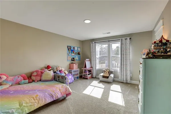 a dining room with furniture a window and wooden floor
