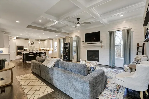 a living room with furniture and a rug